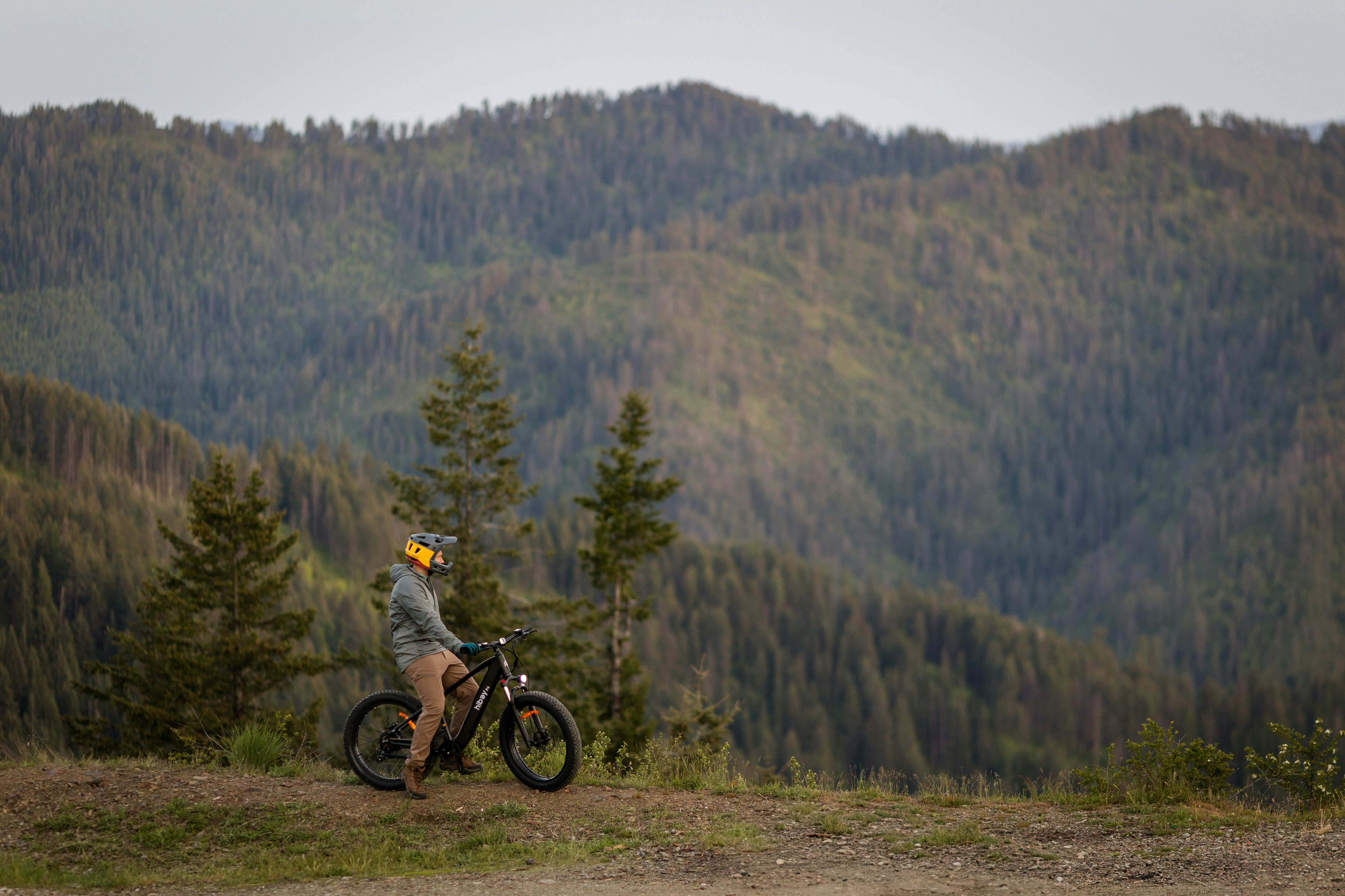 A mountain biker contemplates the scenic view.