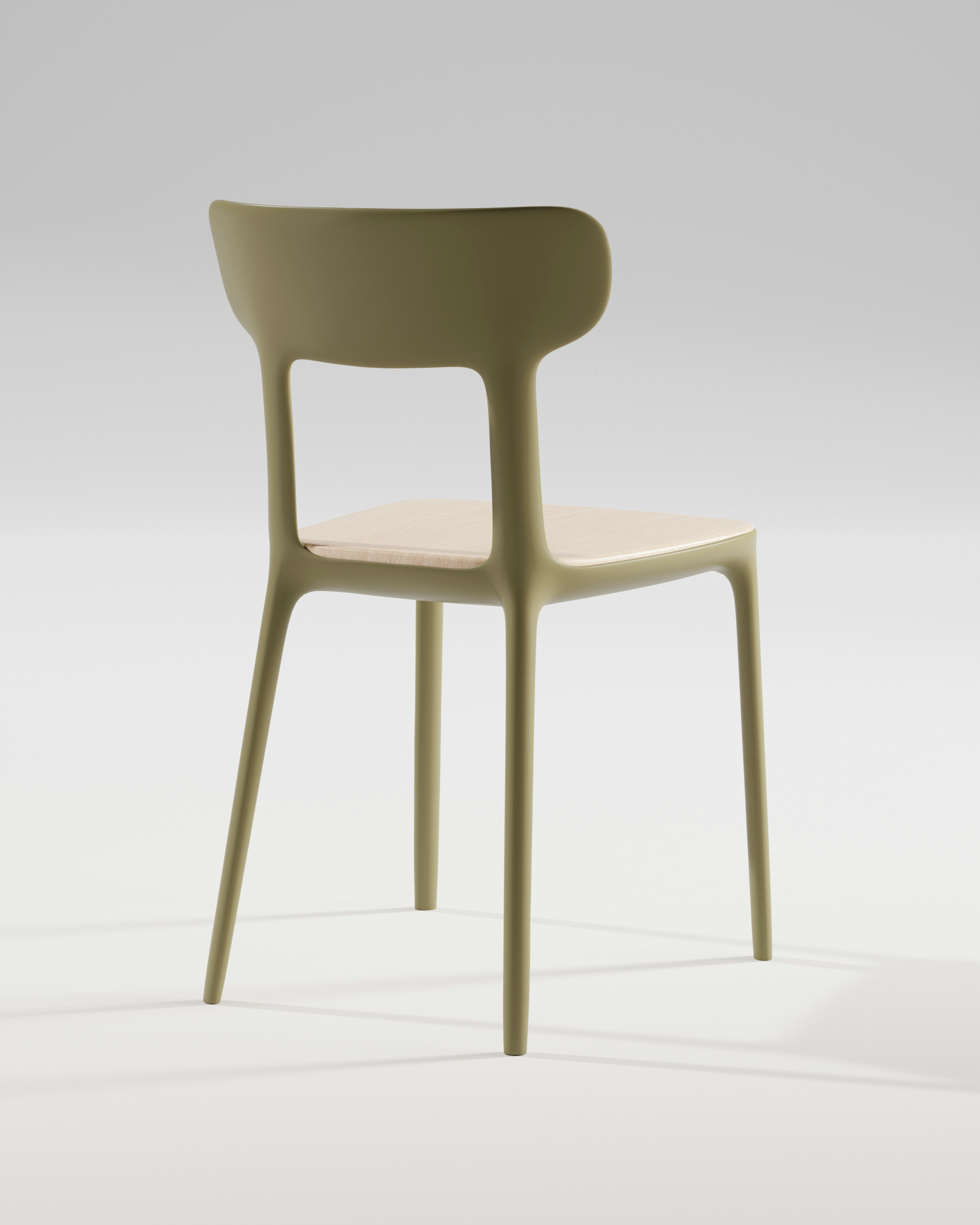 A modern chair stands against a white backdrop.