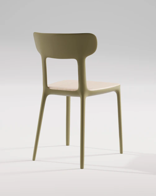 A modern chair stands against a white backdrop