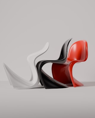 Three iconic chairs in different colors.