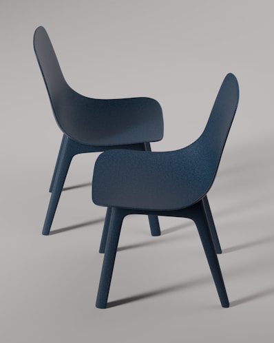 Two modern chairs are displayed in this photograph.