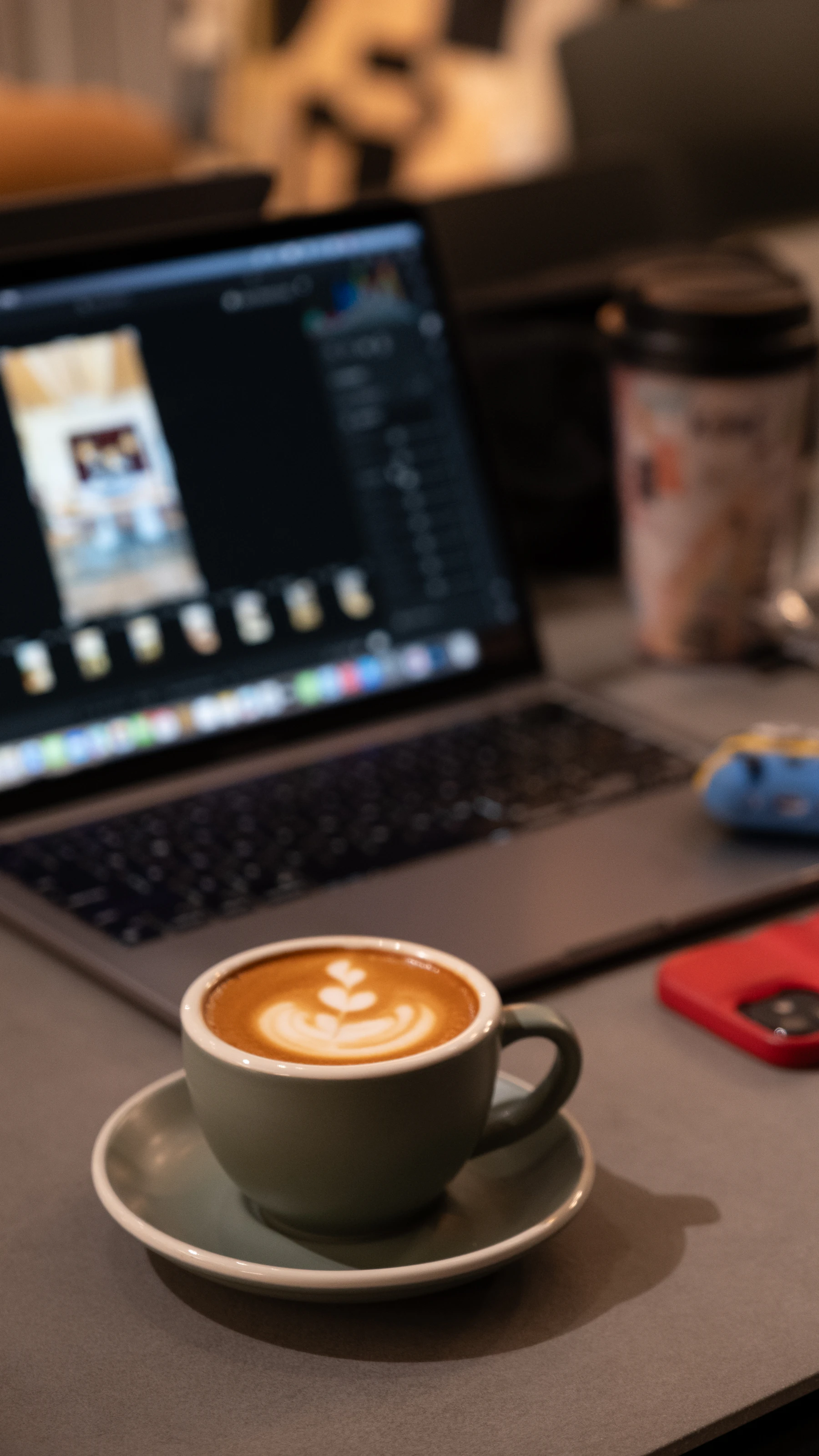 Laptop and coffee on a work desk