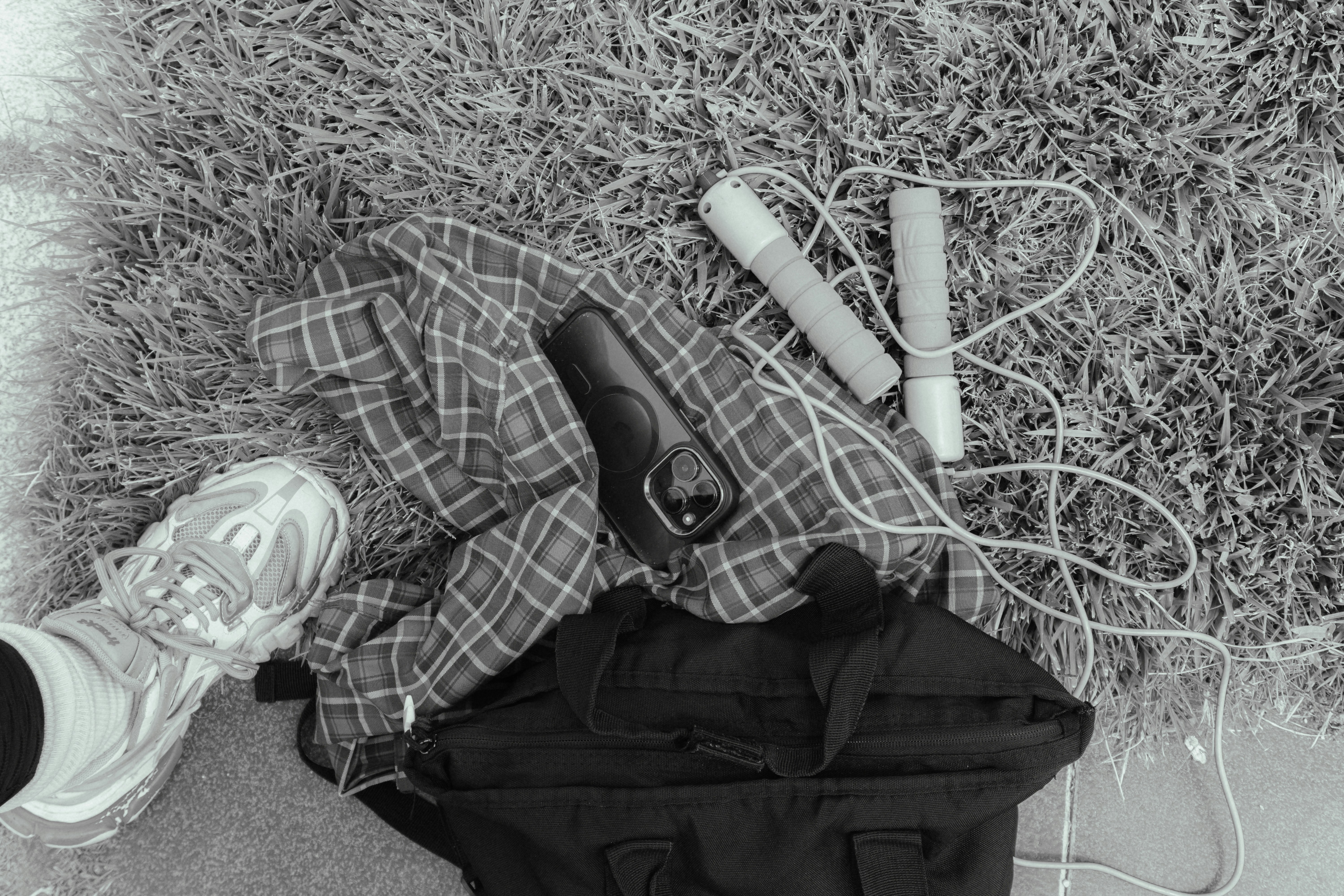 Workout gear is laid out on the grass.