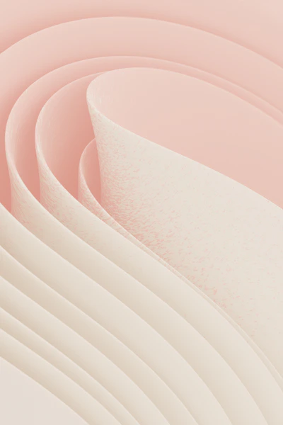 Curving white and pink paper creates an abstract design.