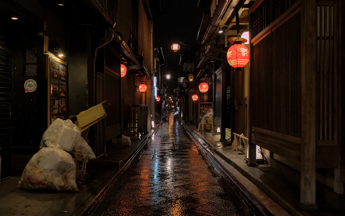 Higashiyama Kyoto — narrow lantern-lit Pontocho alleyway at night in the Gion district