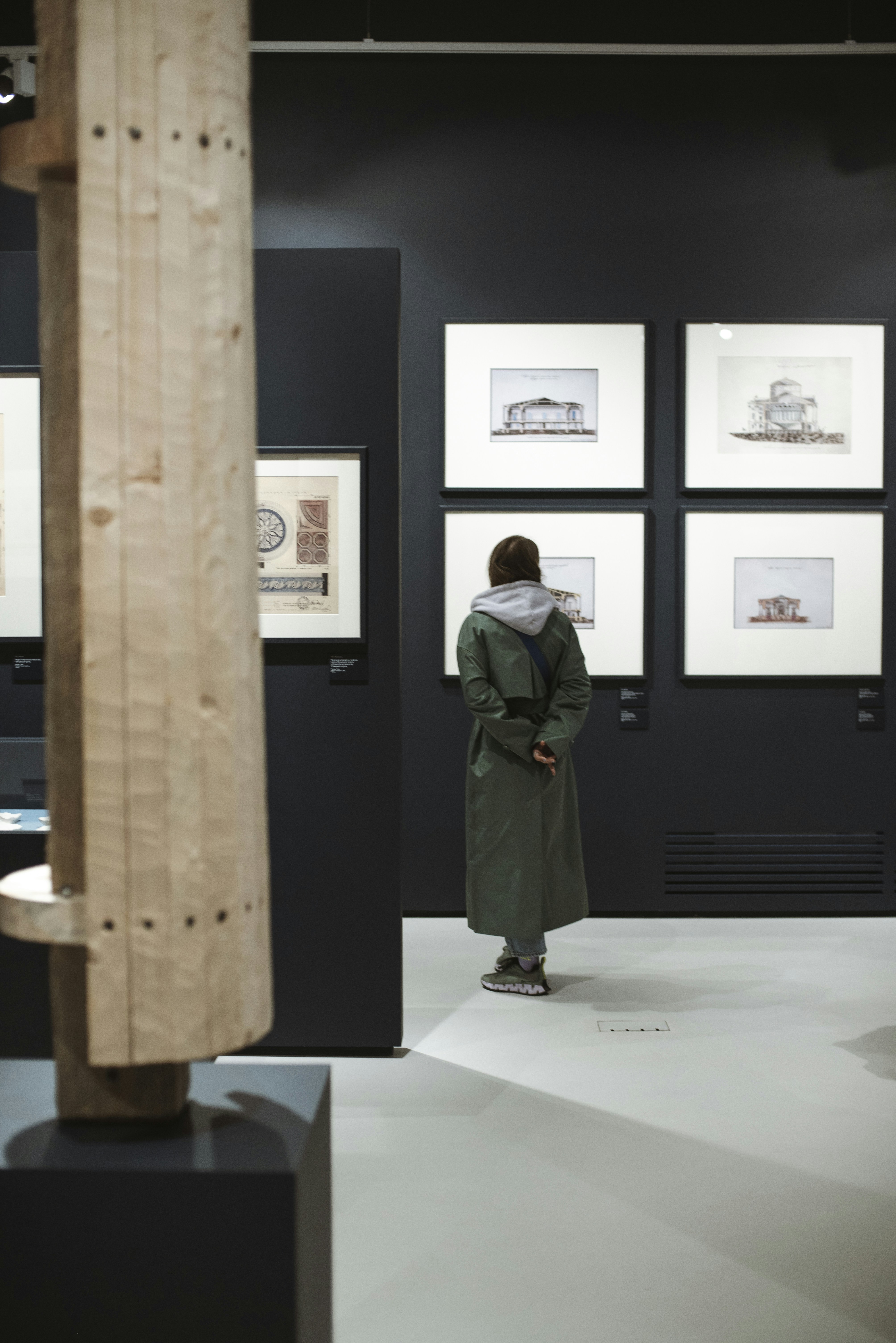 A person studies art in a museum.