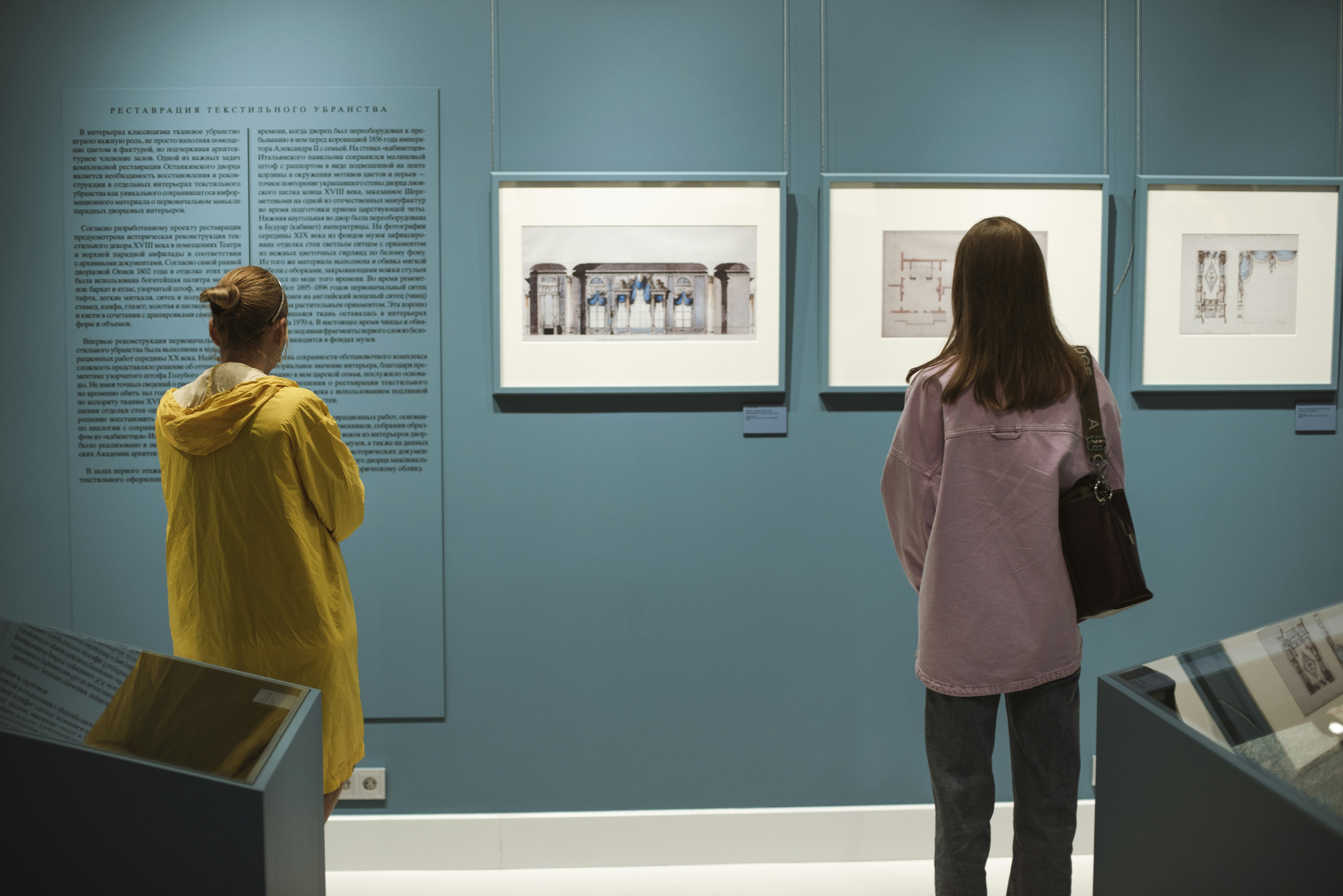 People are looking at art in a museum.