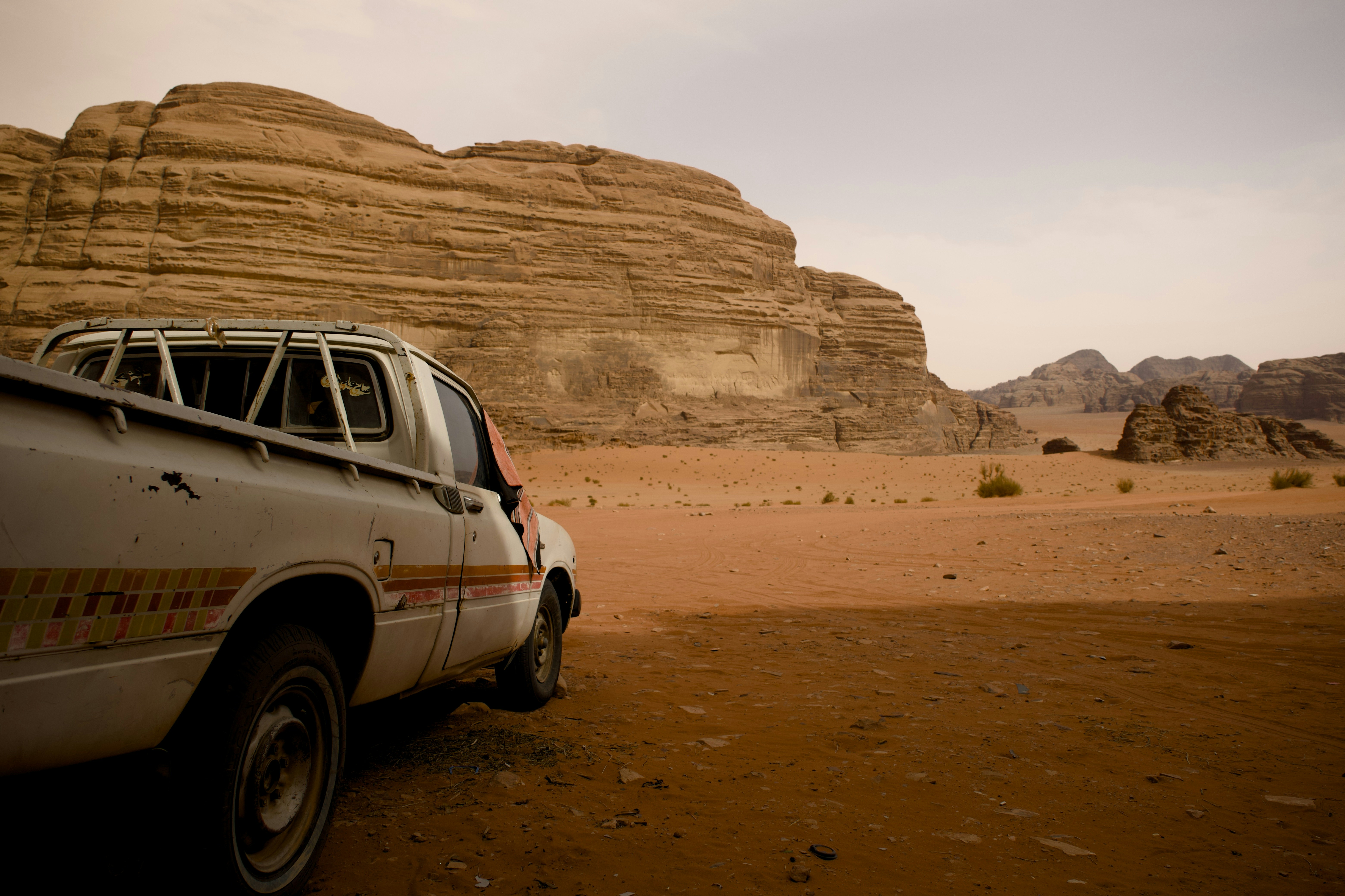 Truck parked in the desert landscape.