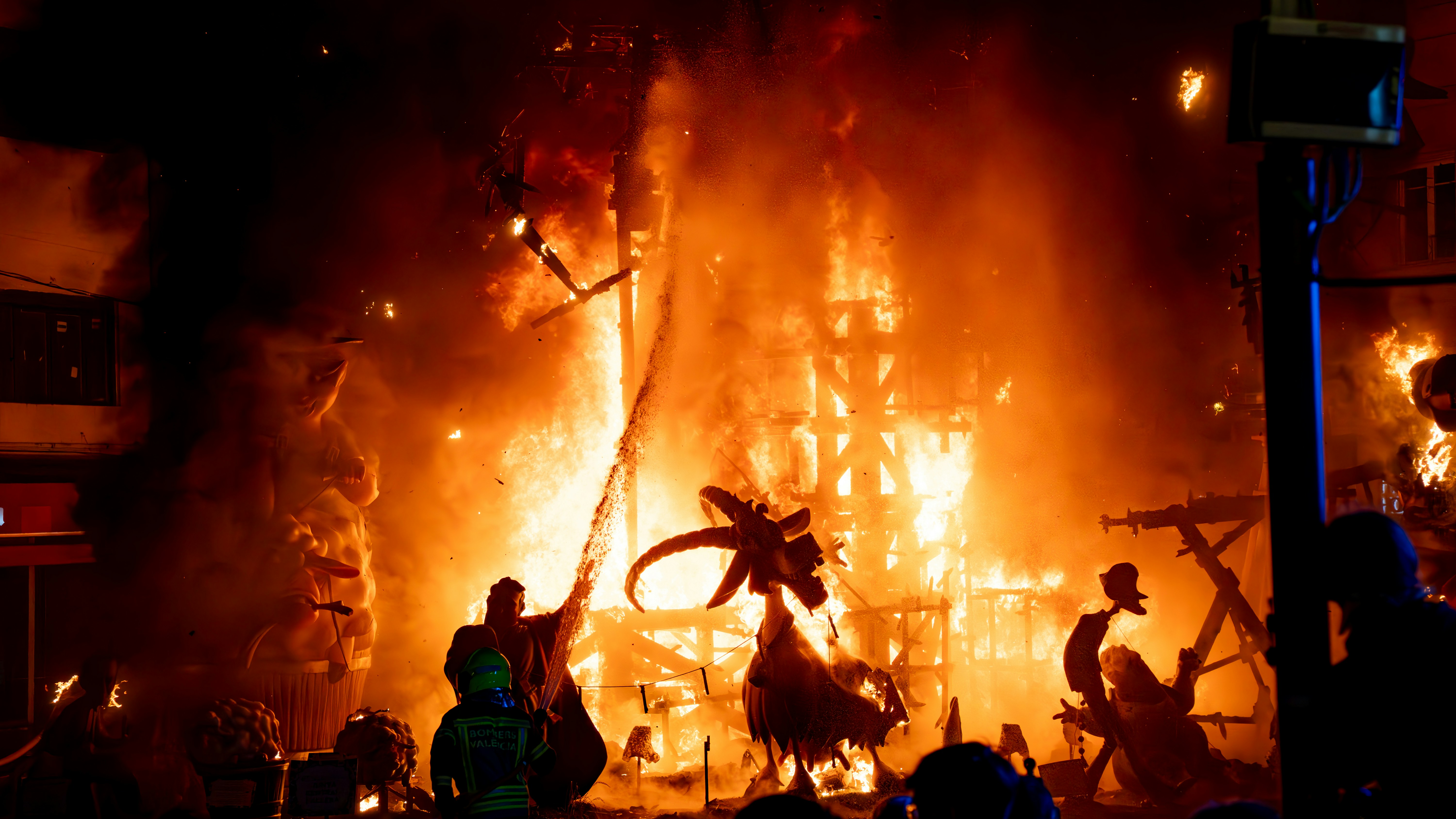 A monument burns brightly amidst flames.