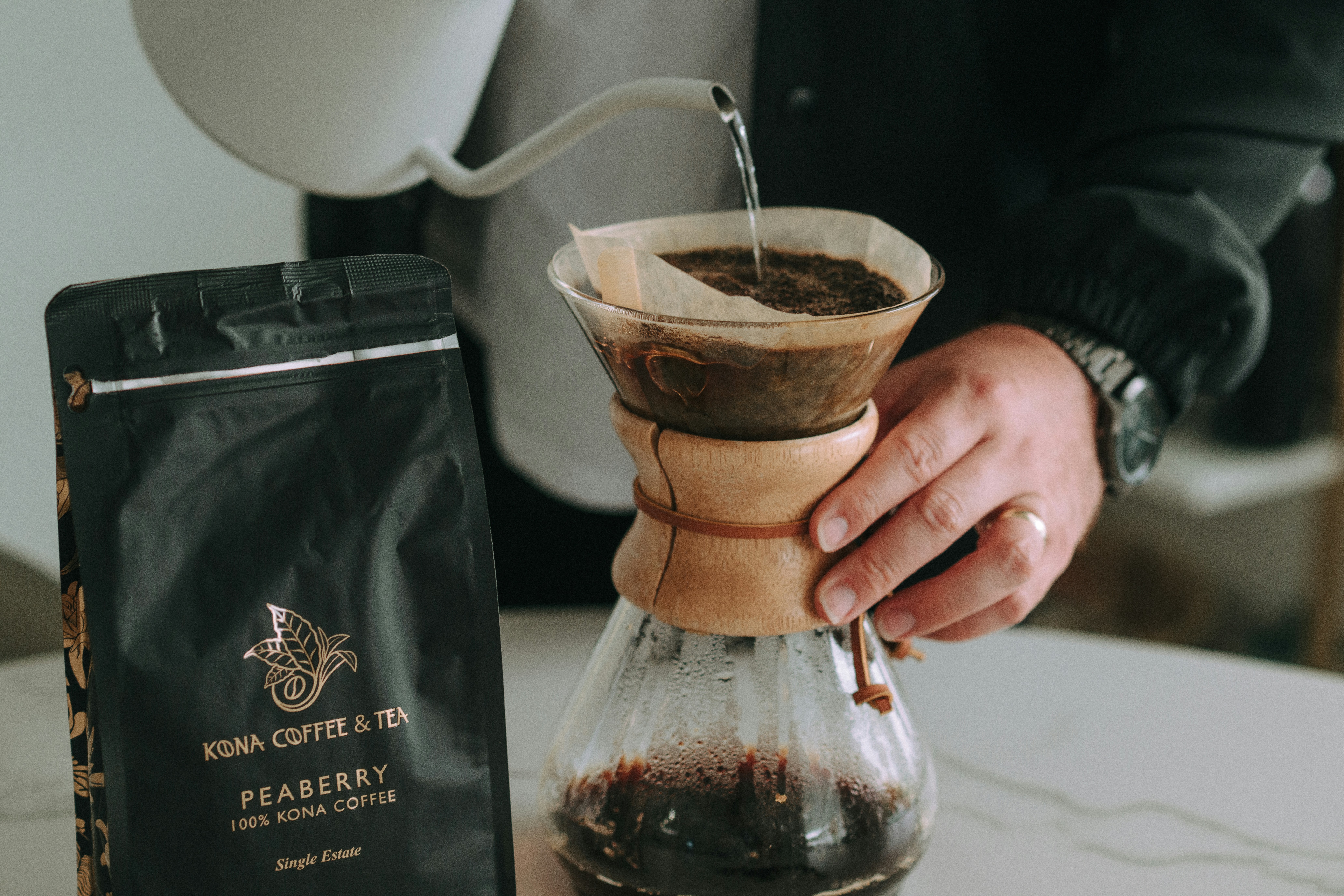 Someone is brewing coffee using a pour-over method.
