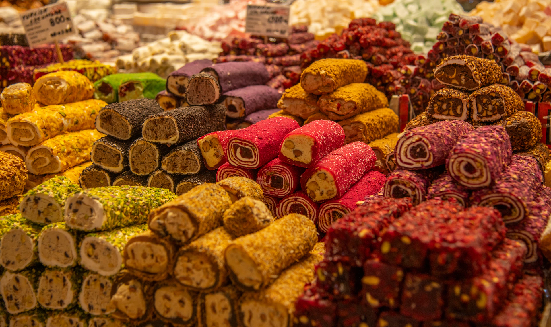 Colorful turkish delight is piled high for sale.