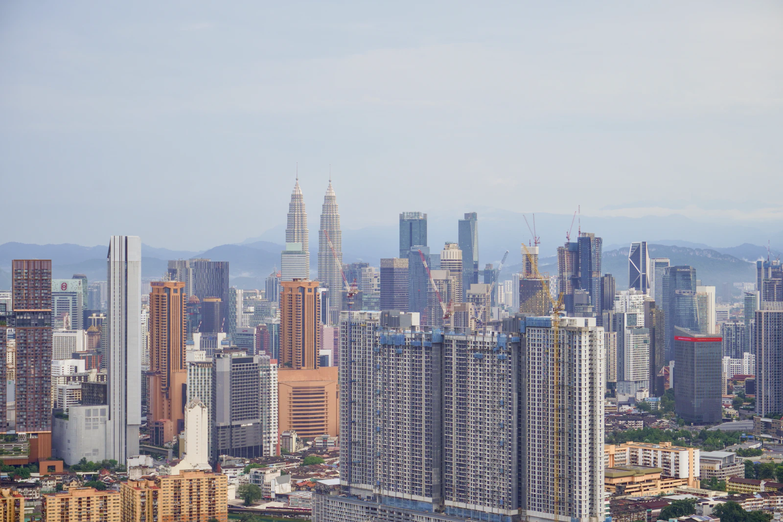 Kuala Lumpur skyline with residential towers in front of the Petronas Twin Towers
