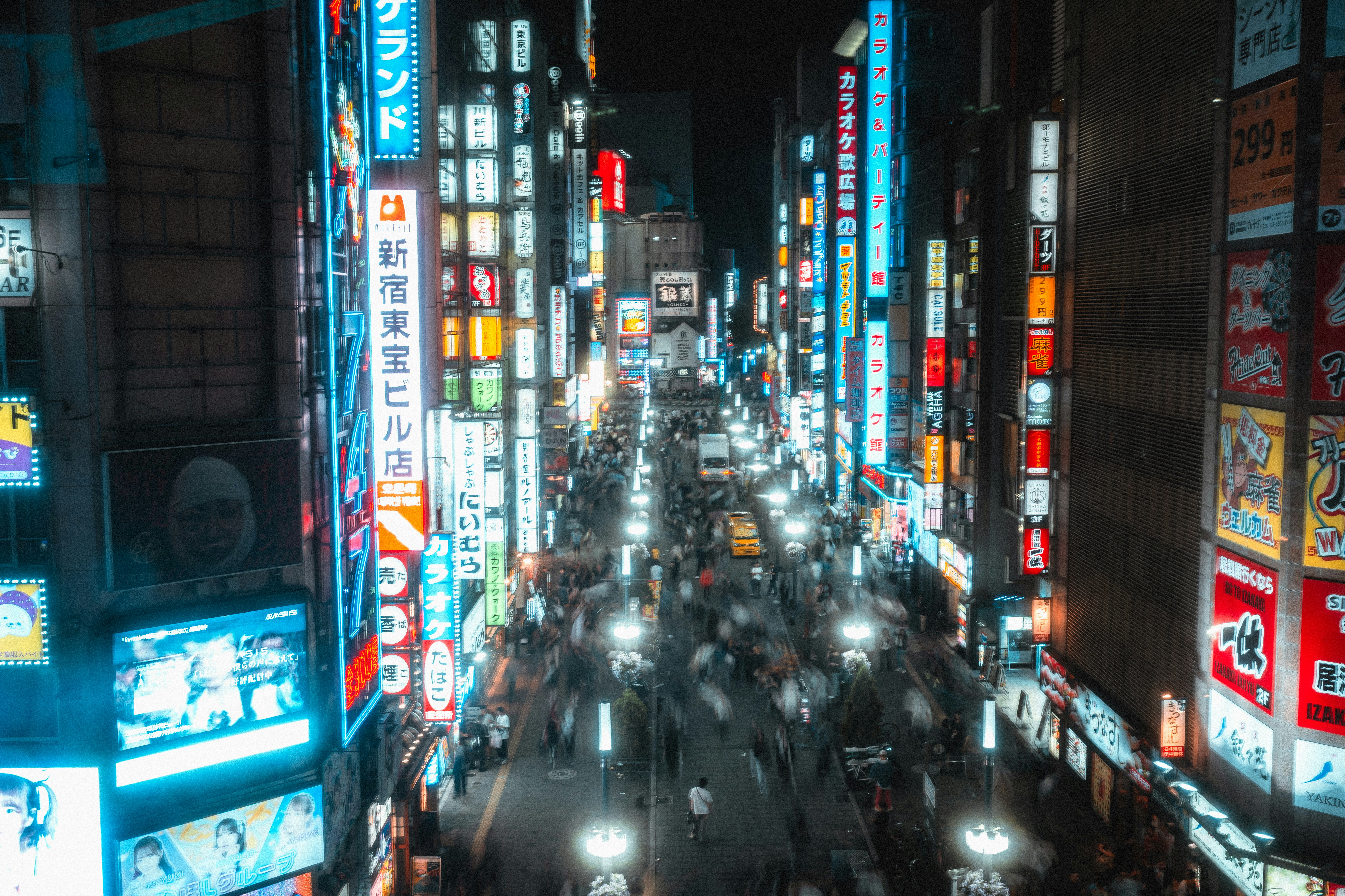 Shinjuku Kabukicho street at night with bright neon lights and people