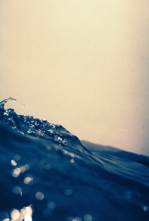 The wave crests against the light.