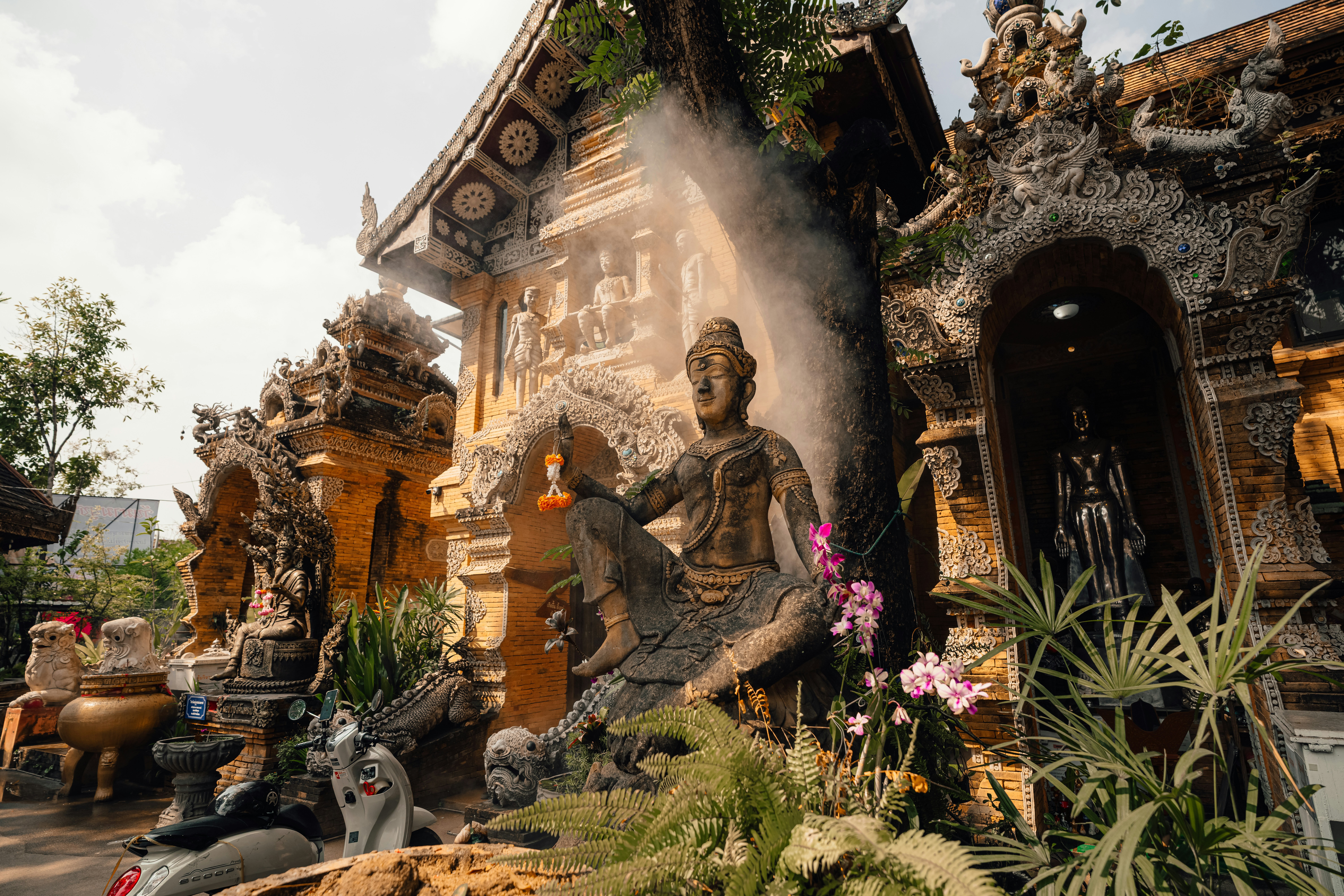 A decorated temple with a large statue.