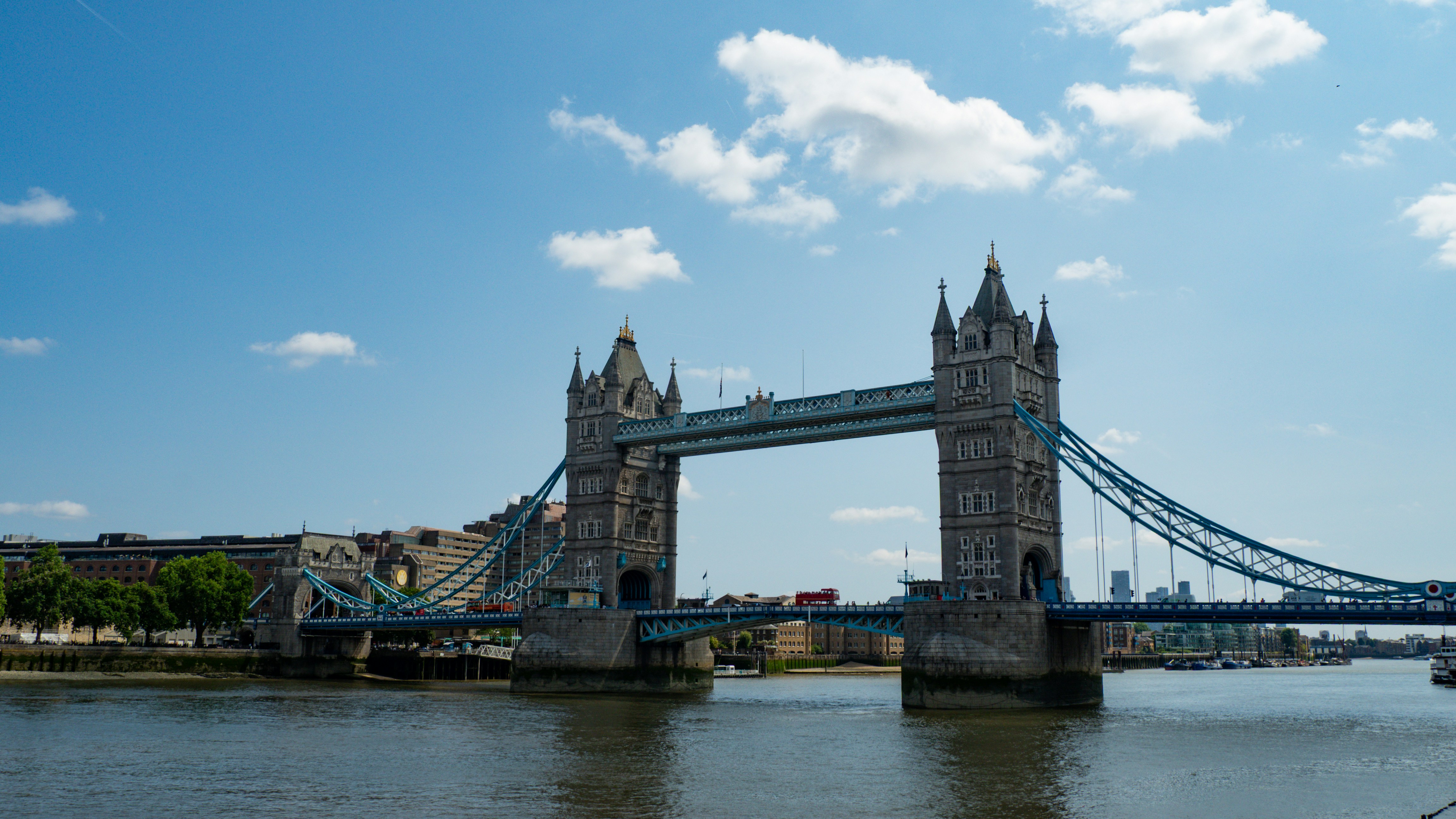 The tower bridge stands tall over the river.