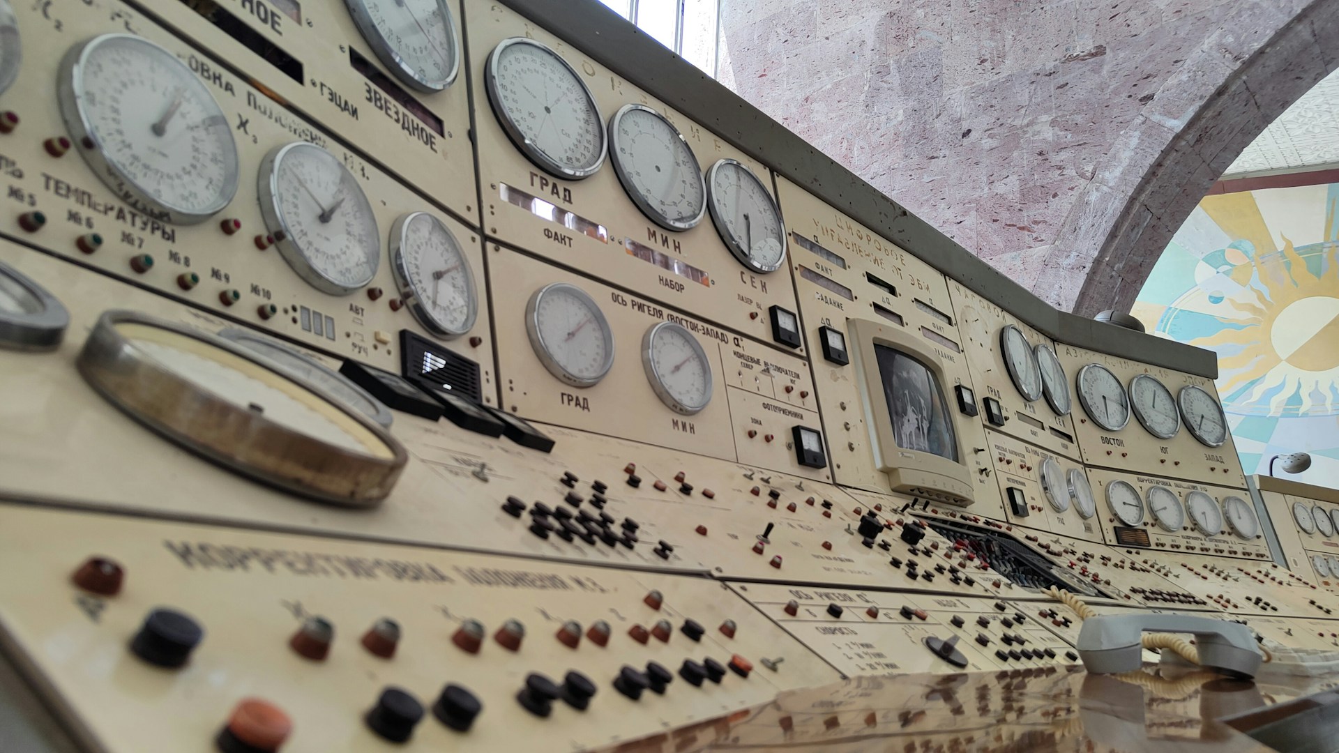 Vintage control panel is filled with gauges and buttons.