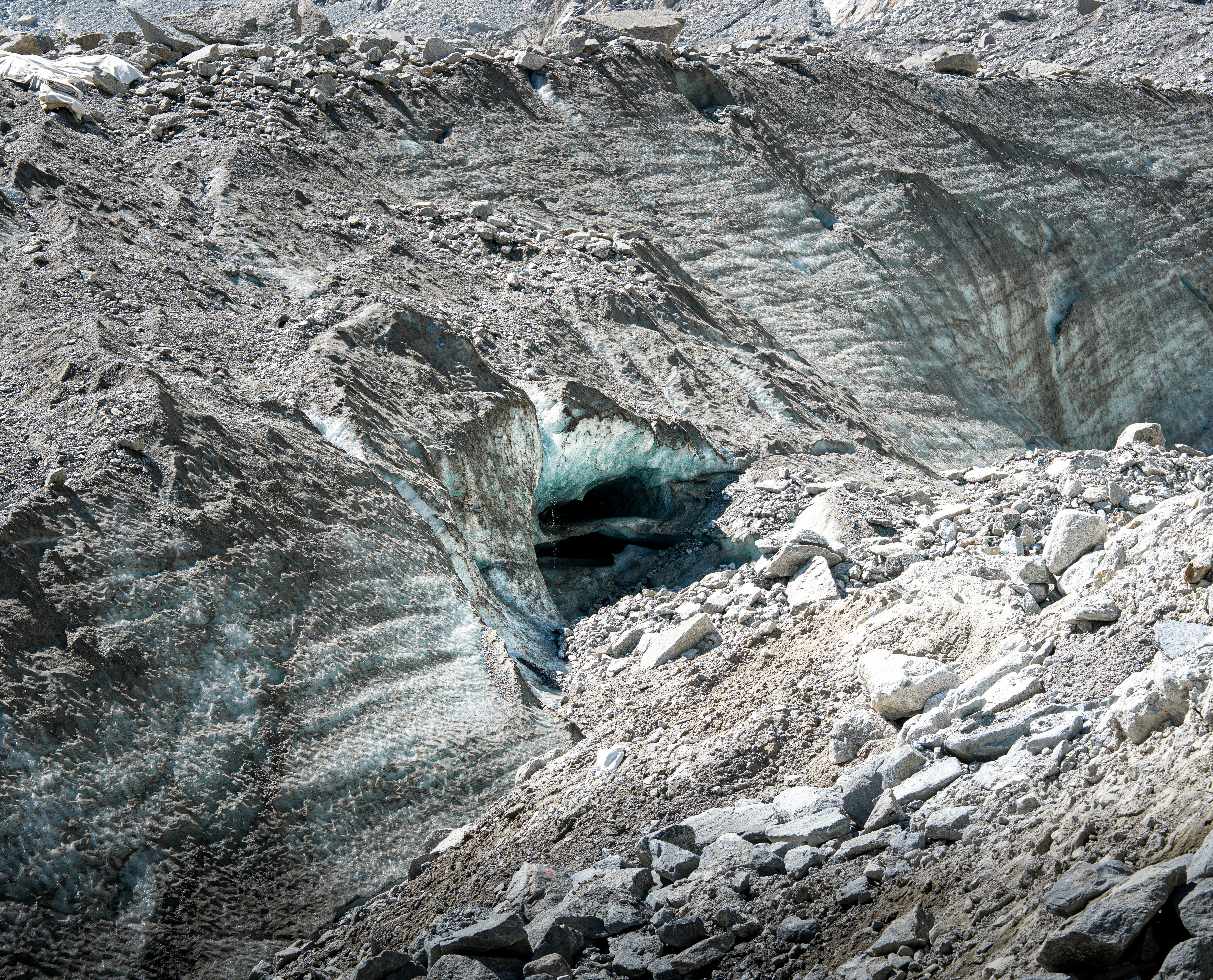 An ice cave and glacier create a scenic view.