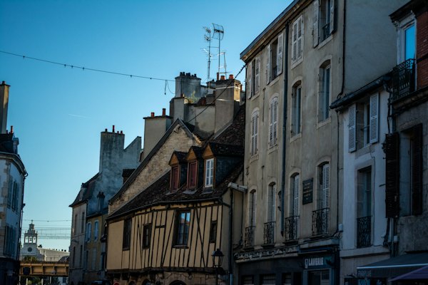 A sunny street of the old town — Dijon, France