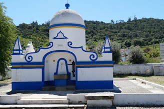 A beautiful white and blue building stands outdoors.