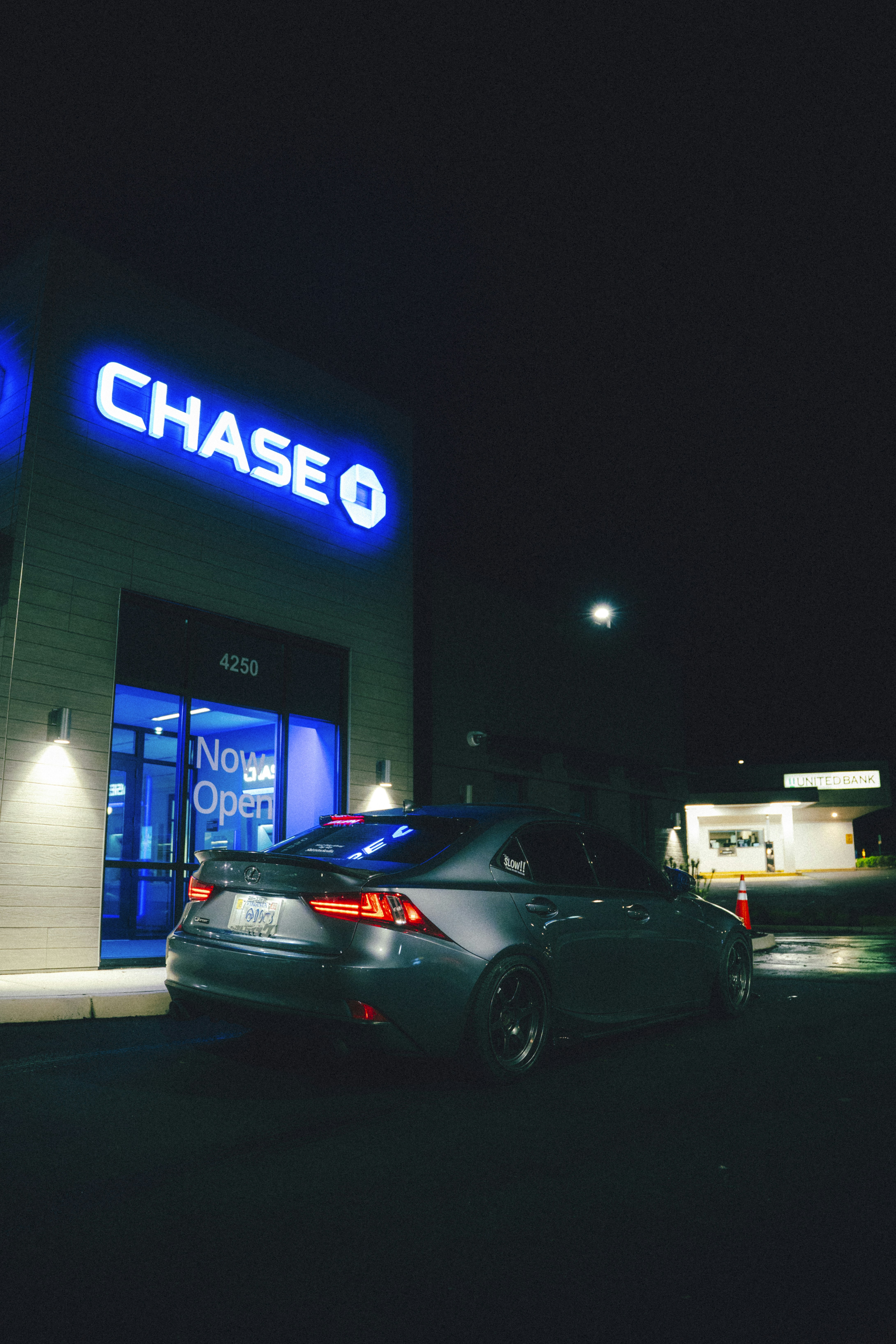 A car is parked in front of a chase bank.