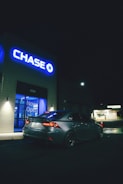 A car is parked in front of a chase bank.