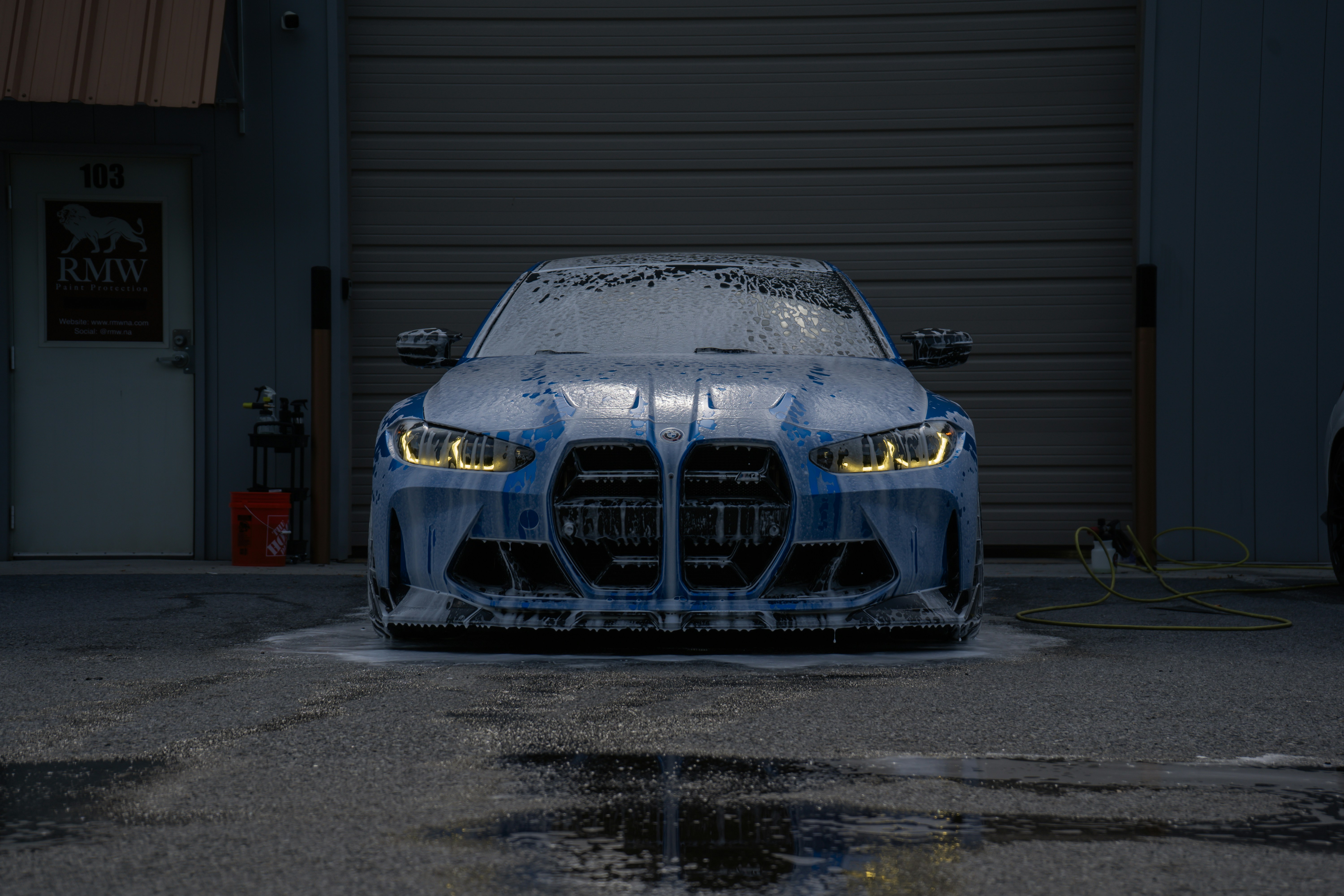 Car being hand washed with foam