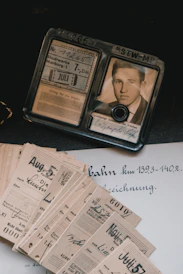 Vintage id and tickets are displayed in this image.
