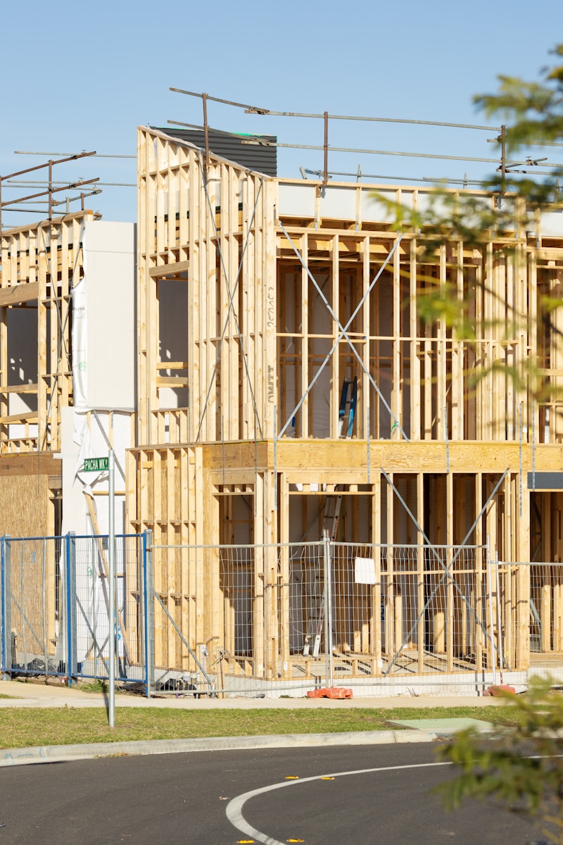 American suburban homes, residential construction site, new housing development, construction workers, wooden house frame