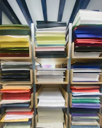 Shelves are stacked with colorful paper.
