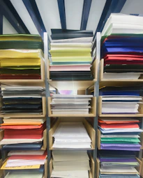 Shelves are stacked with colorful paper.