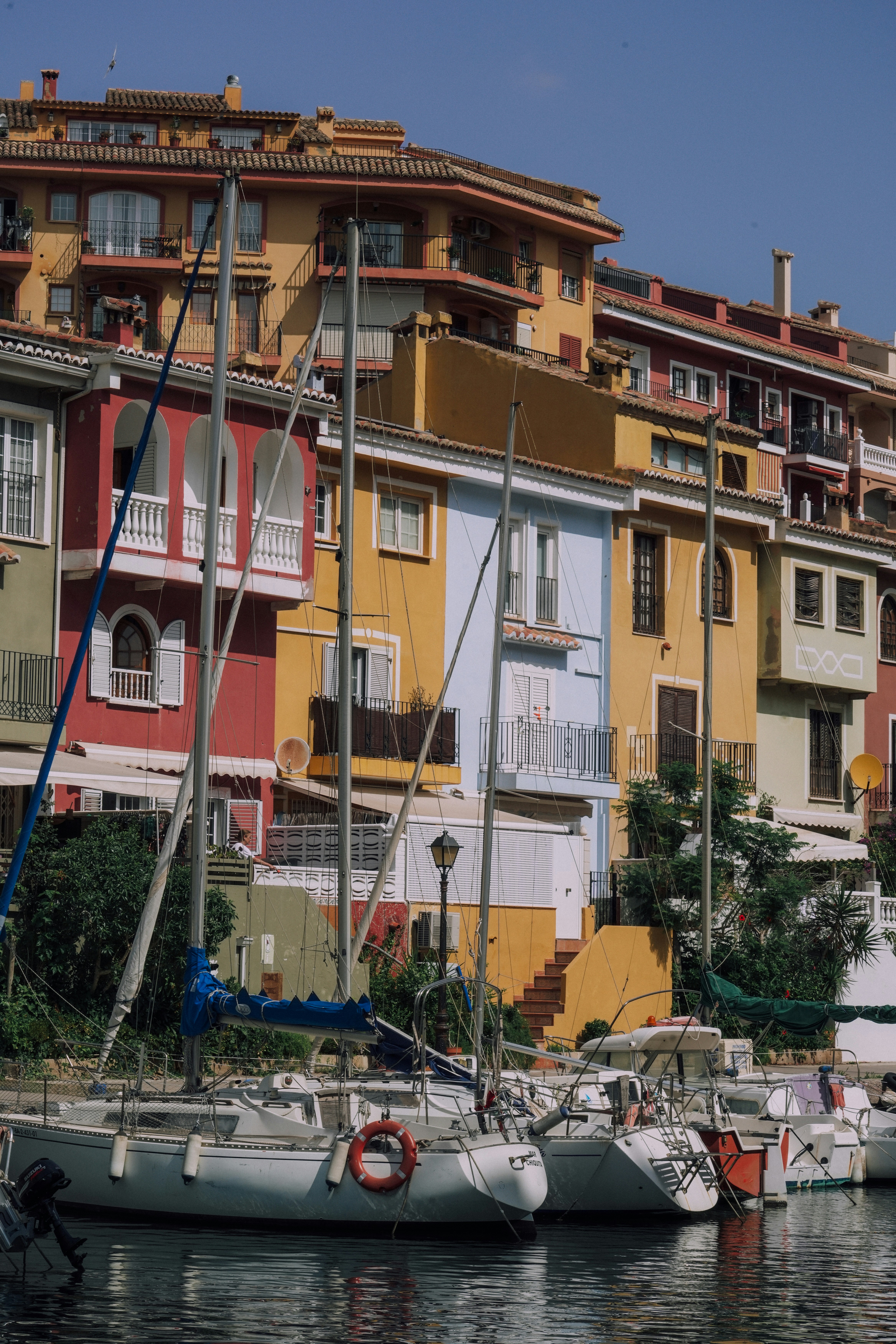 Colorful buildings and boats in a harbor.