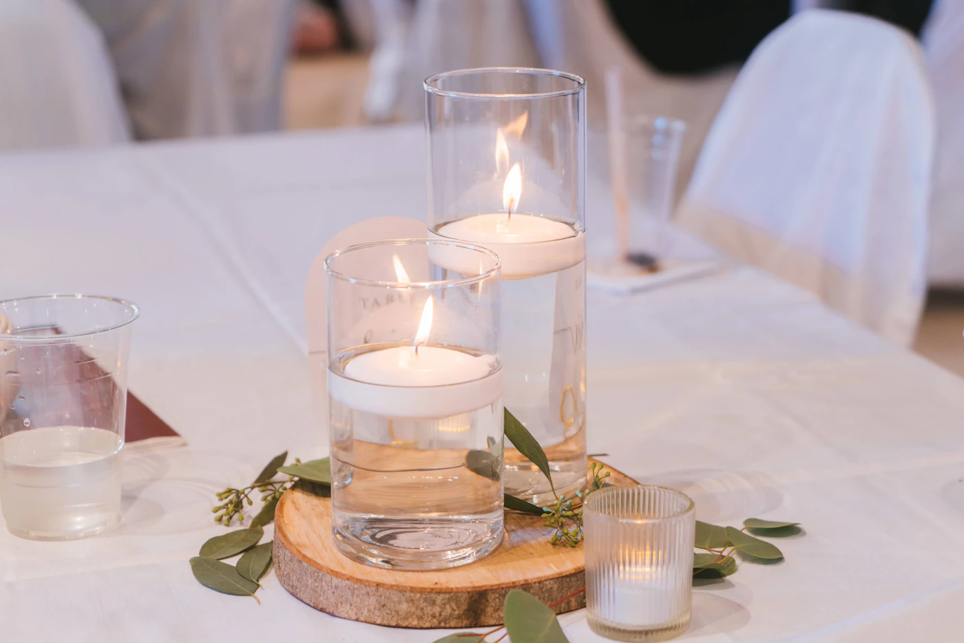 DIY candle holders for romantic wedding tables — Three different heights of DIY candle holders create a romantic tablescape.