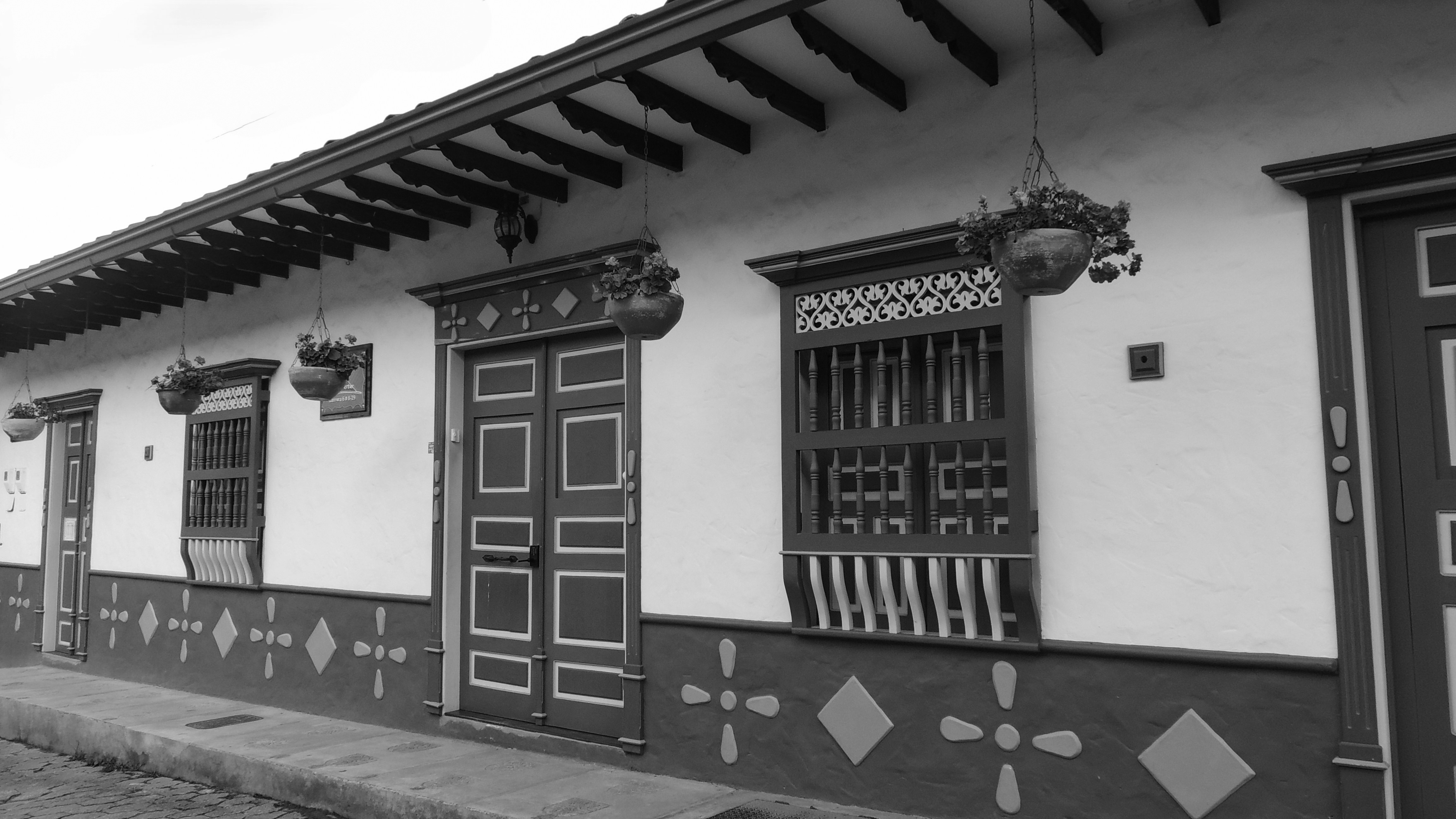 Here's a possible caption: a black and white picture of a building's exterior.