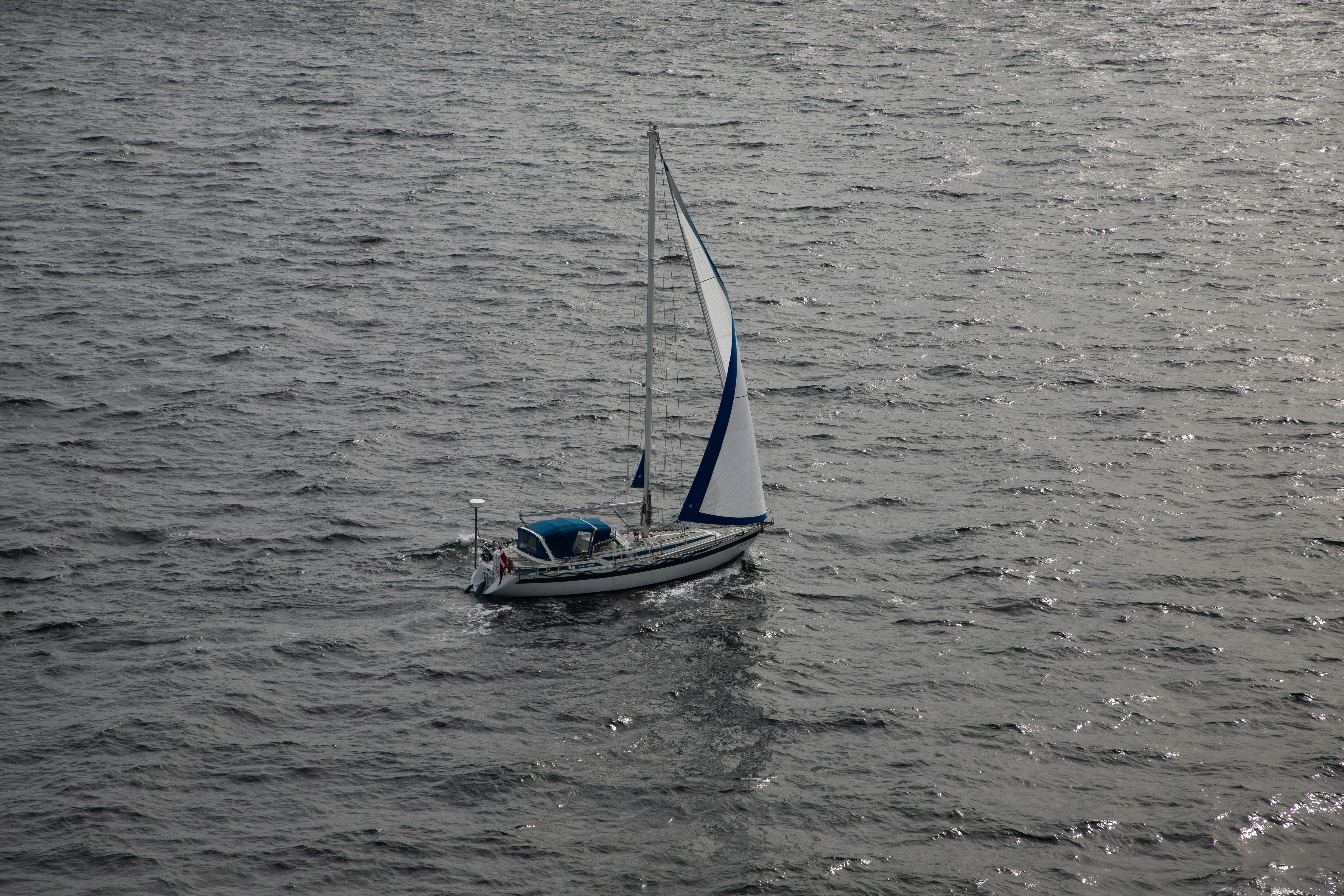 A sailboat floats peacefully on the water.