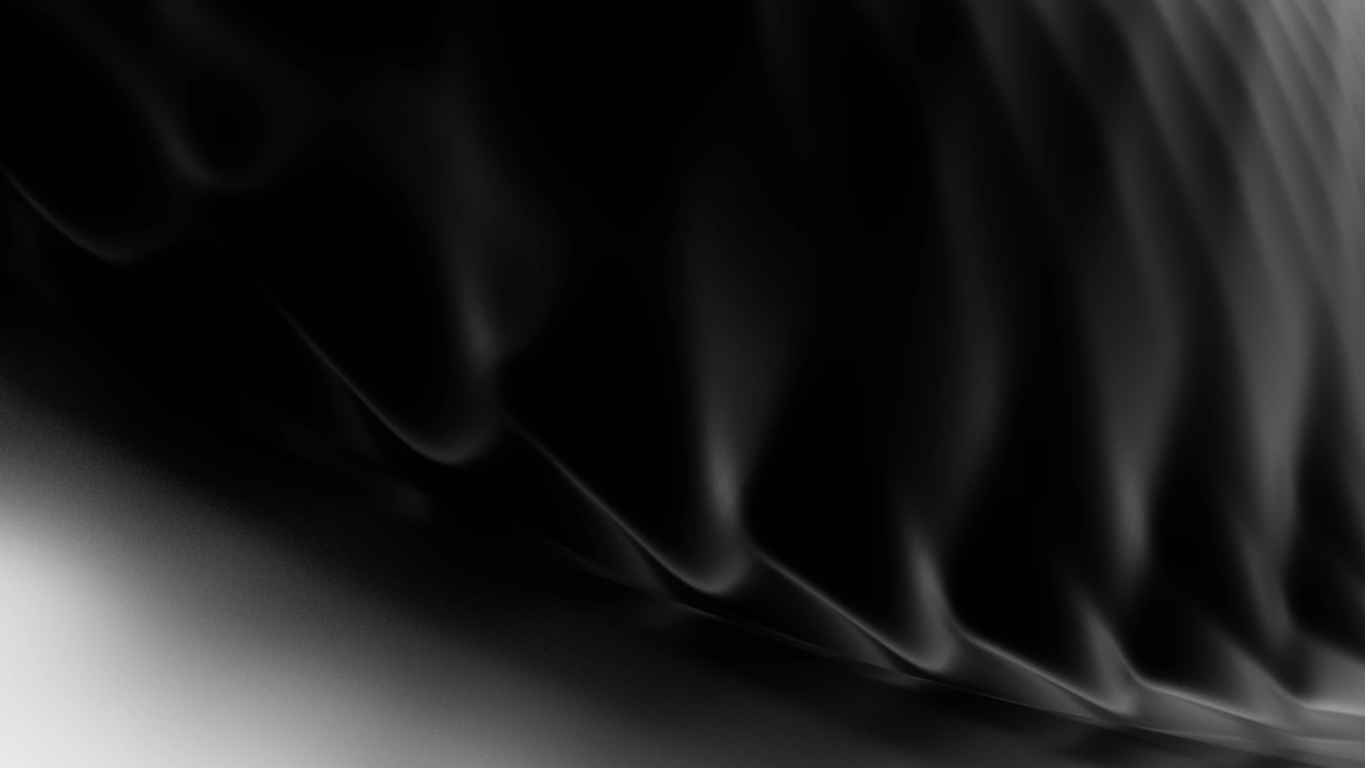 Abstract black and white shapes appear to swirl.