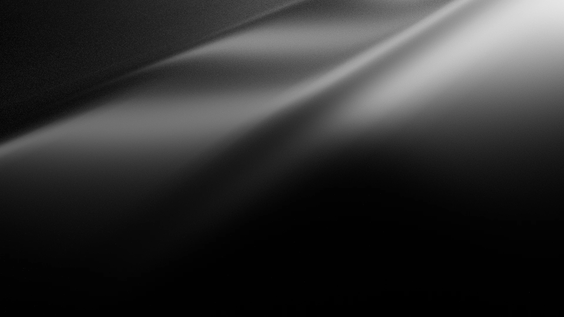Light streaks across a dark, blurred surface.