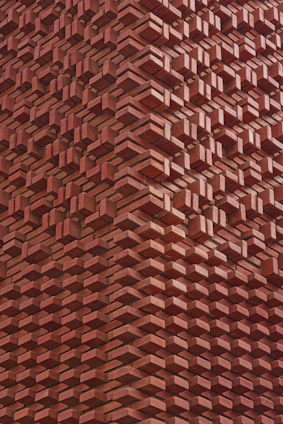 Red brick wall with a unique, layered design.