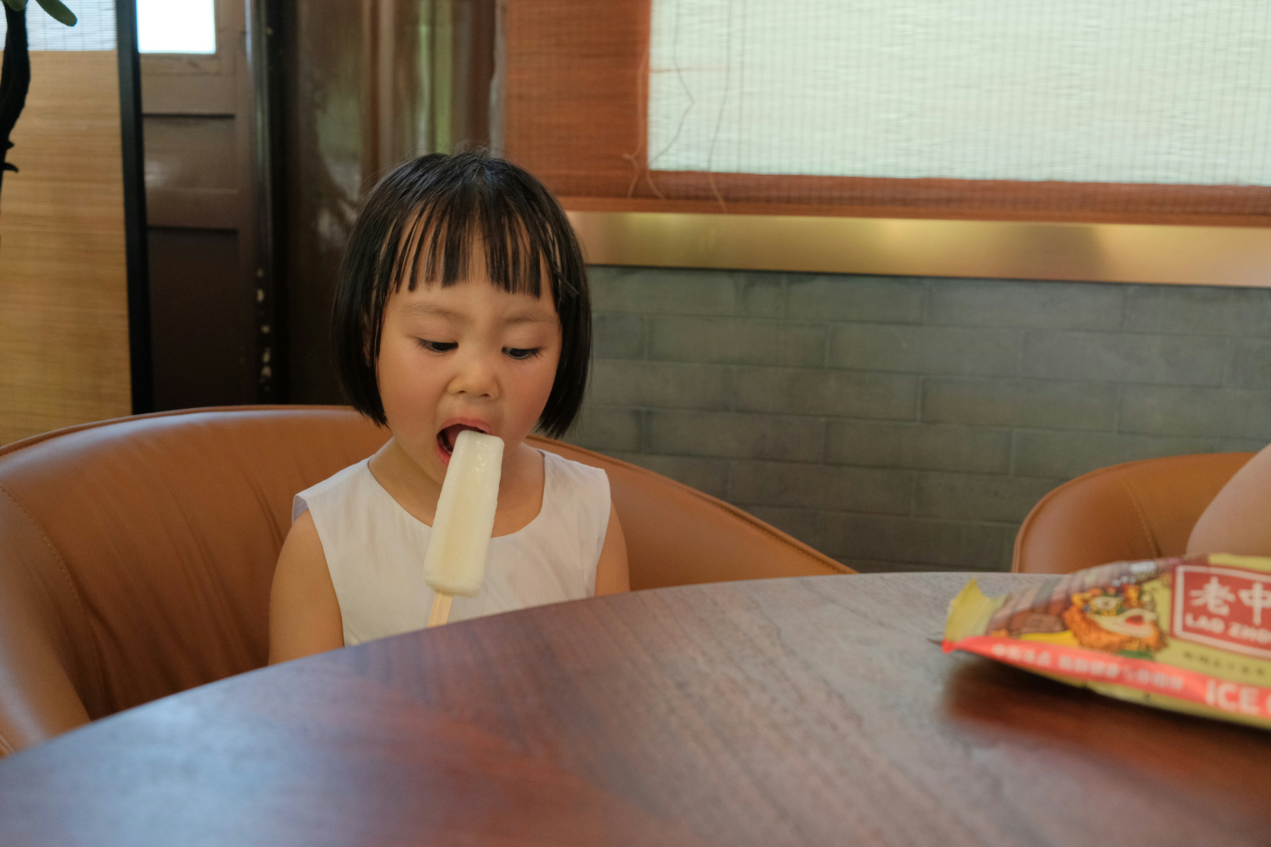 Child eating ice pop instead of healthy food