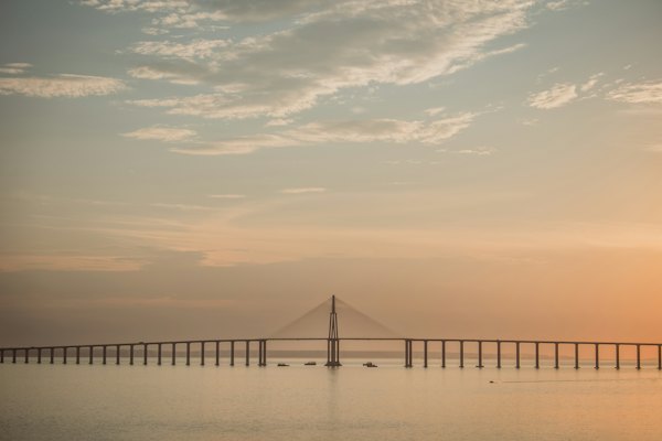 A long bridge spans across calm water — Manaus, Brazil