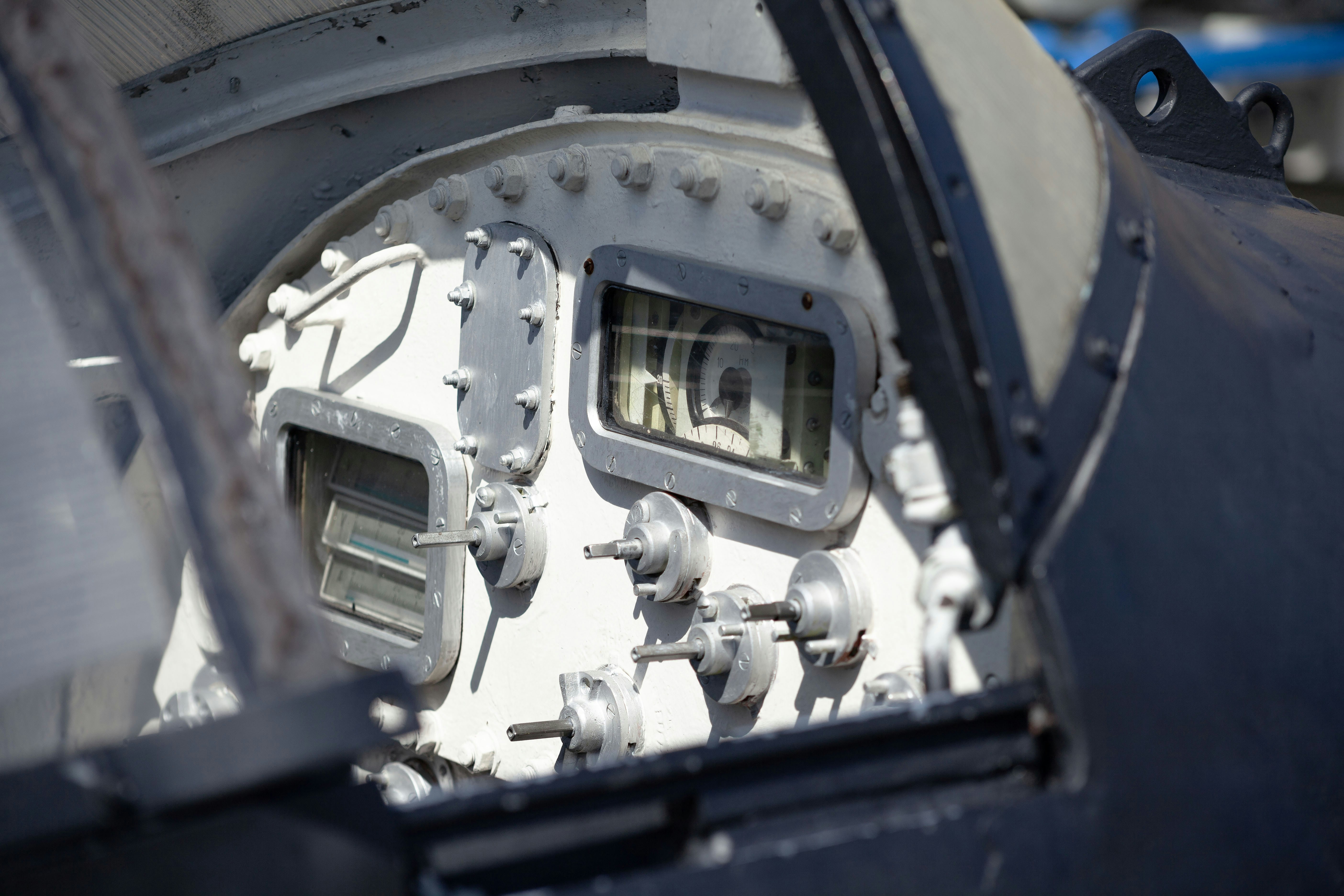 An airplane cockpit view shows gauges and controls.
