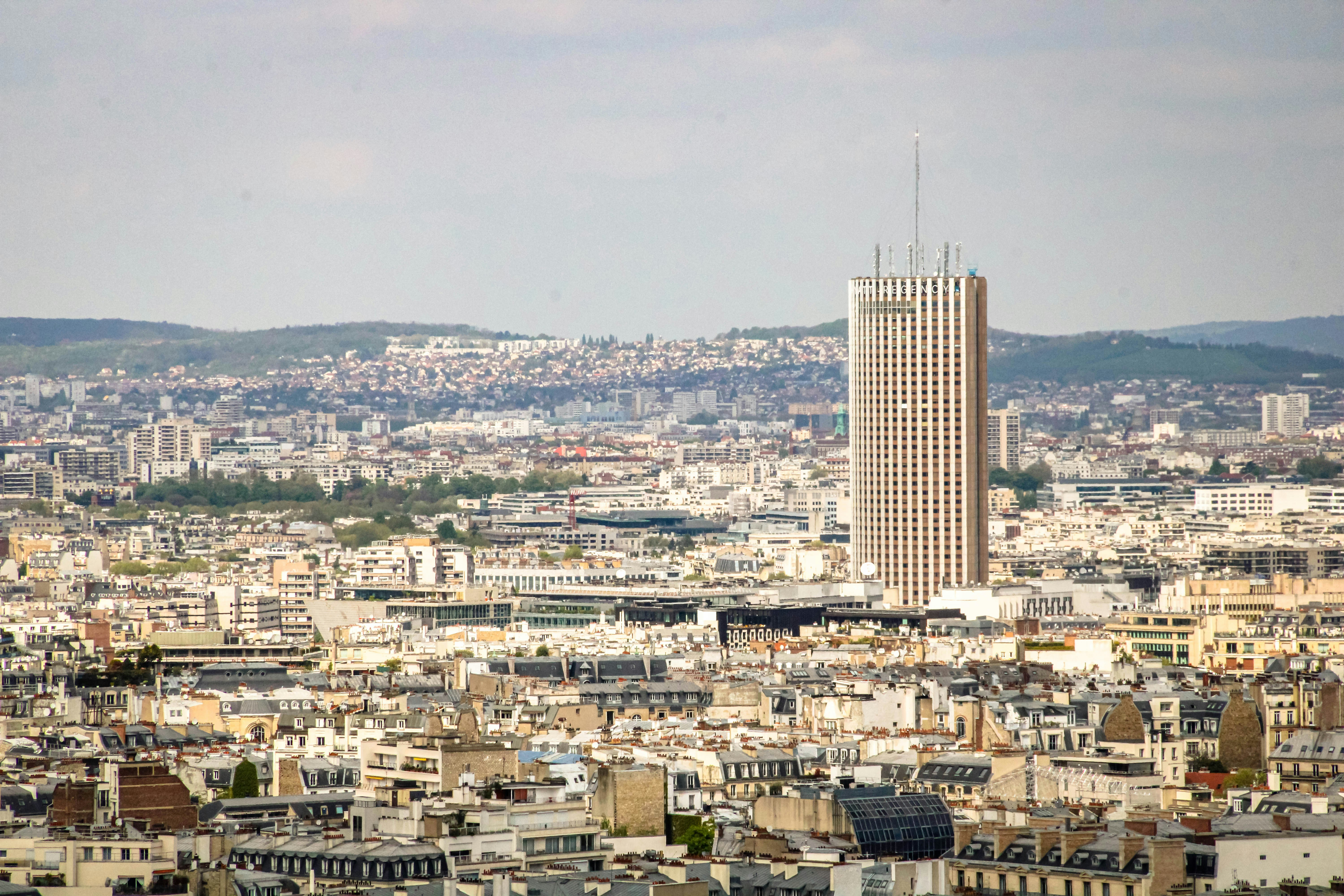 A tall skyscraper stands in the city skyline.
