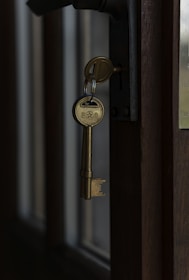 Keys hanging in a door lock.