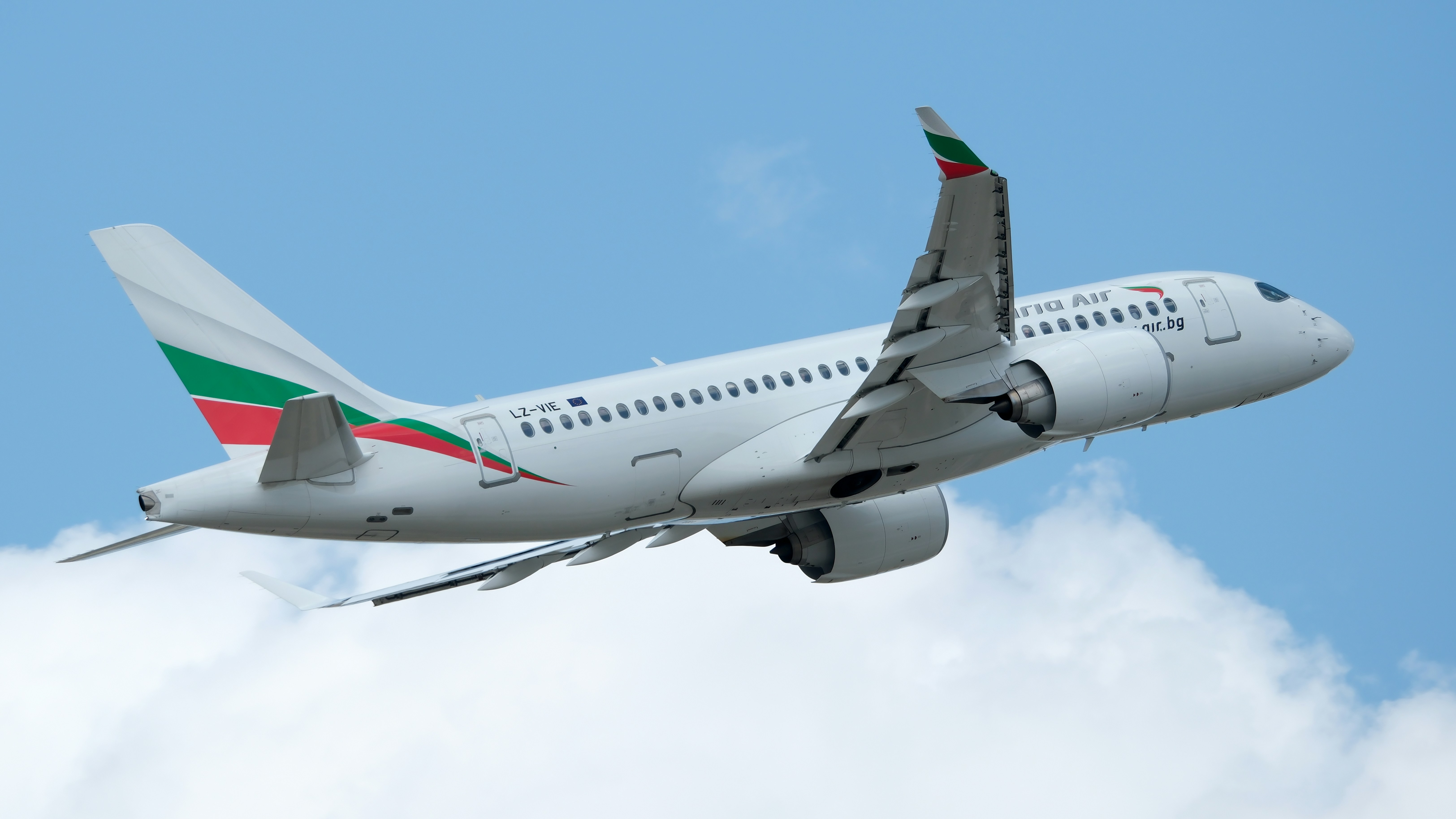 An airplane soars through the sky.