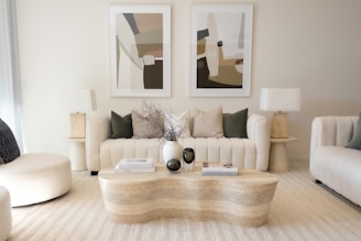 Elegant living room with neutral colors and art.
