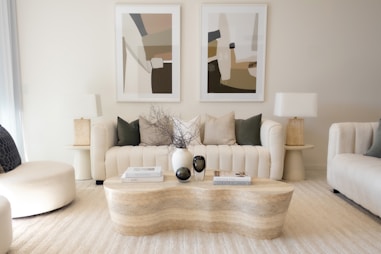 Elegant living room with neutral colors and art.