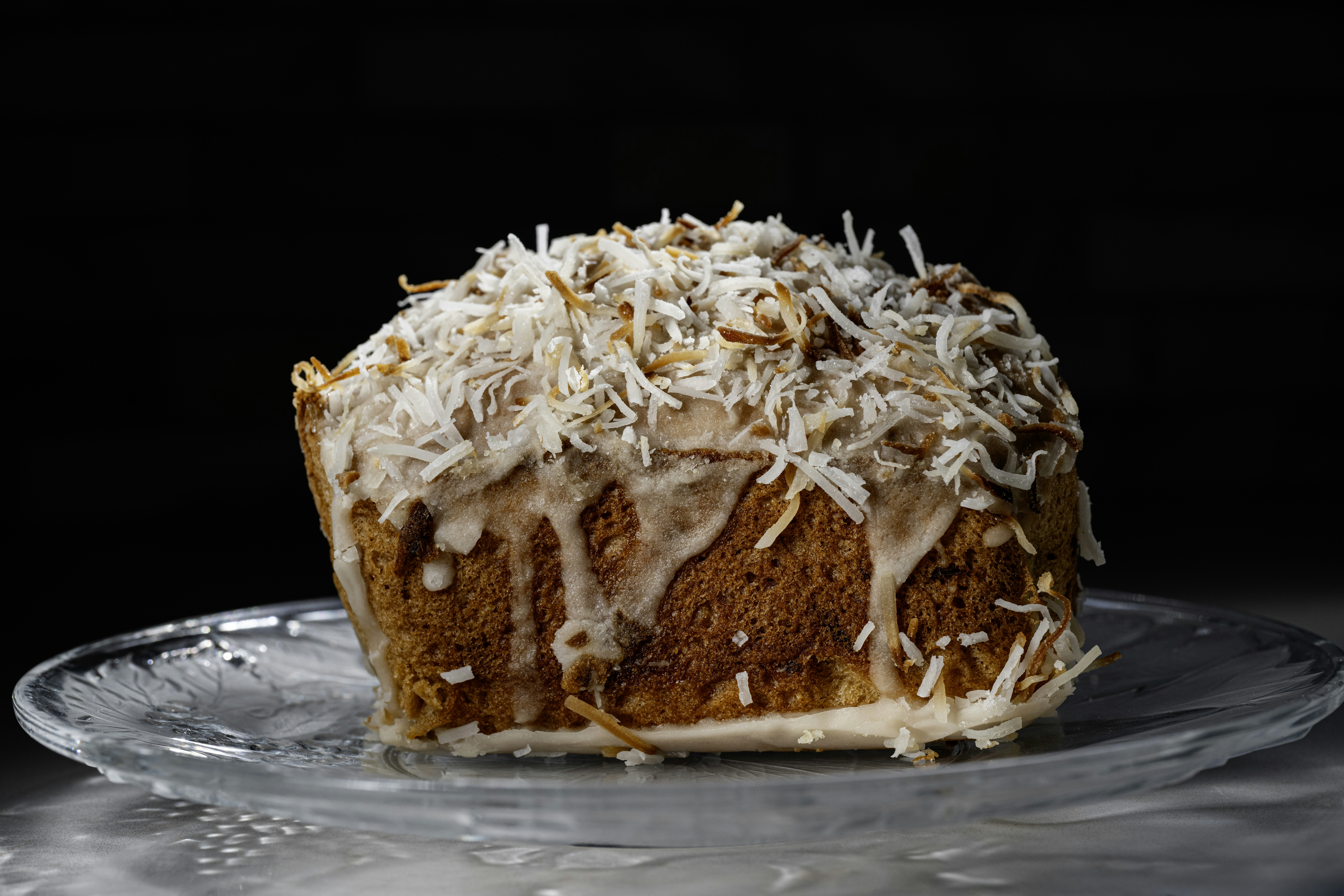 A delicious cake with coconut and glaze.