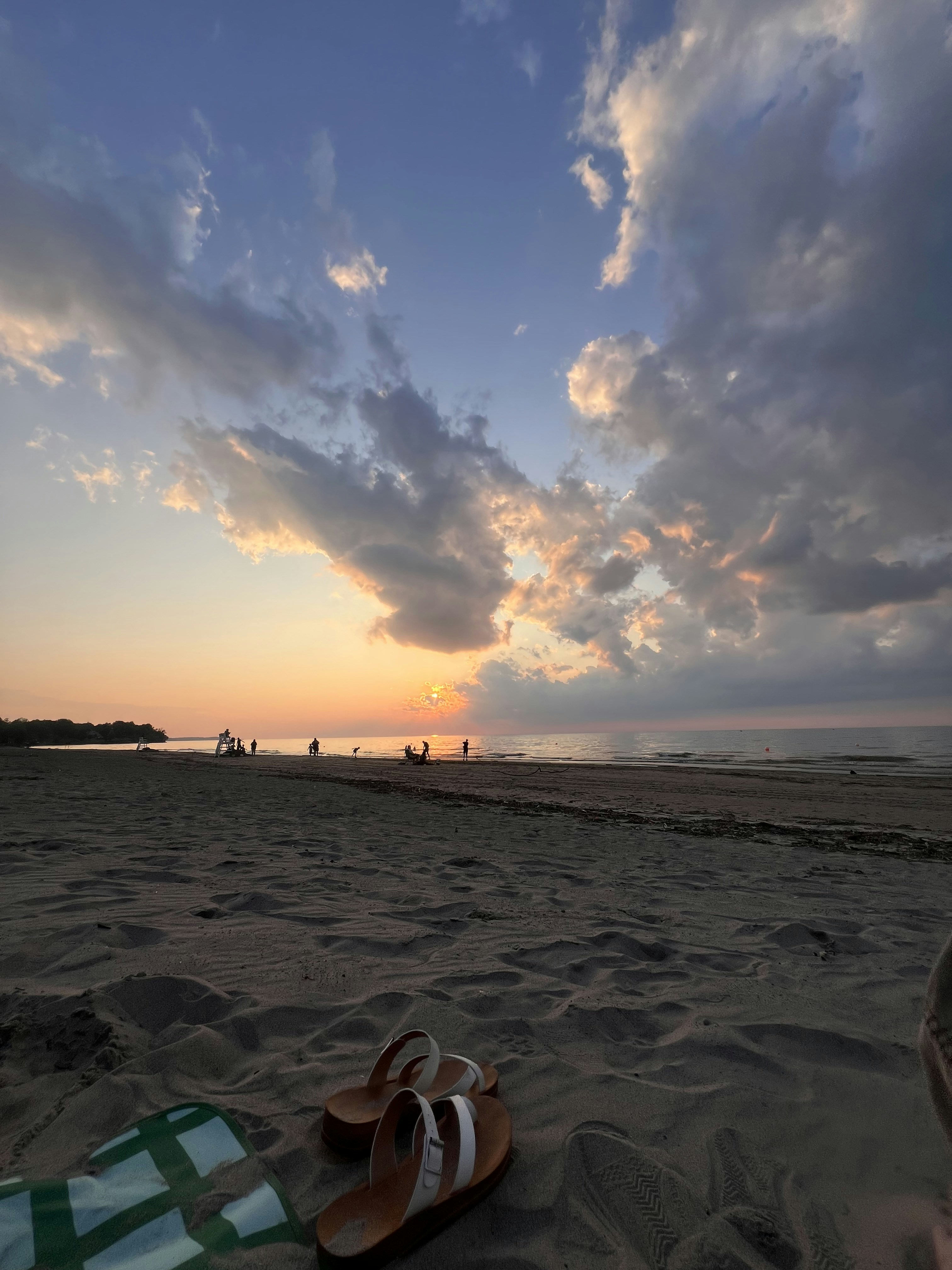 Beautiful sunset over the beach with sandy foreground.