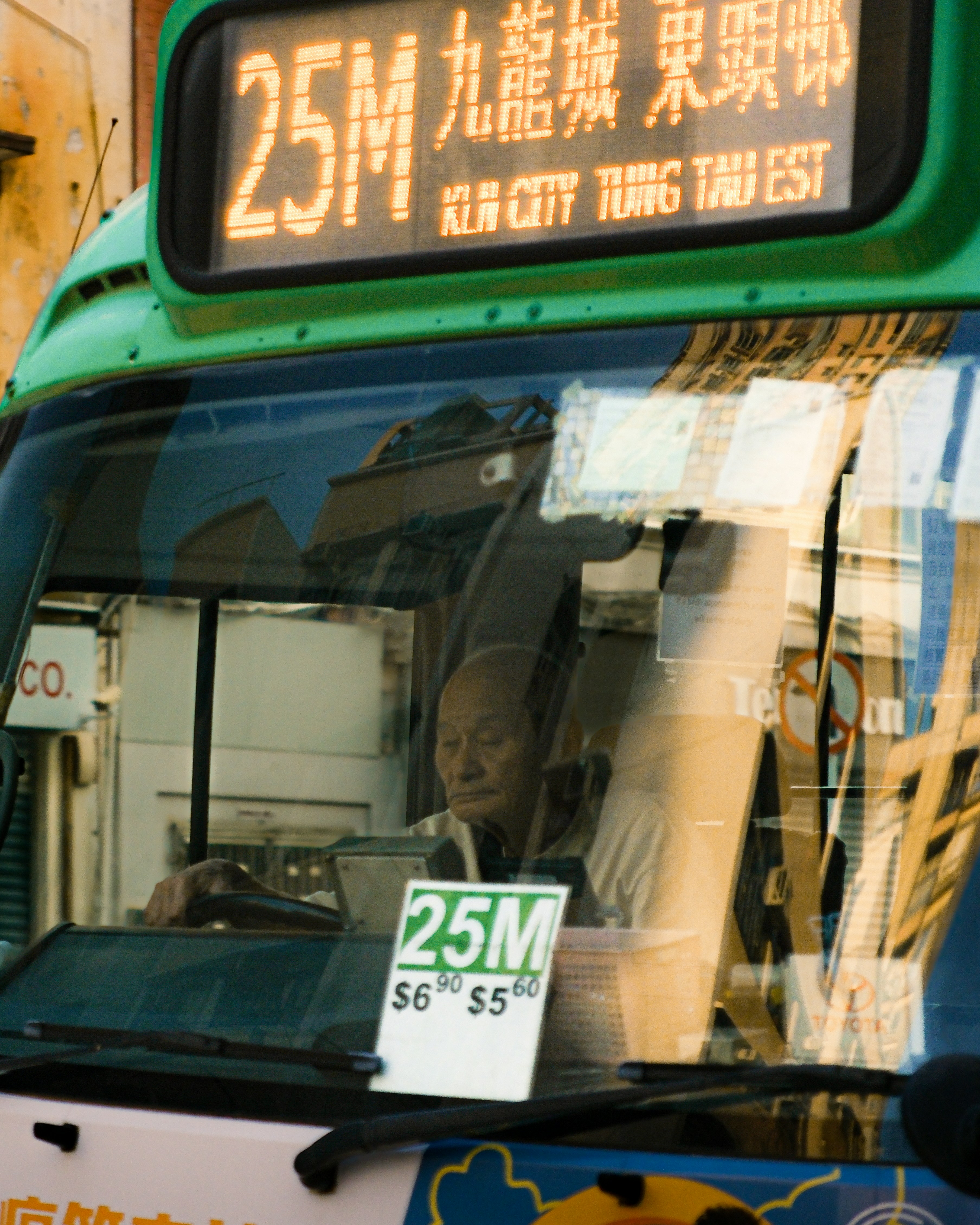 A bus driver is working on a public transport route.