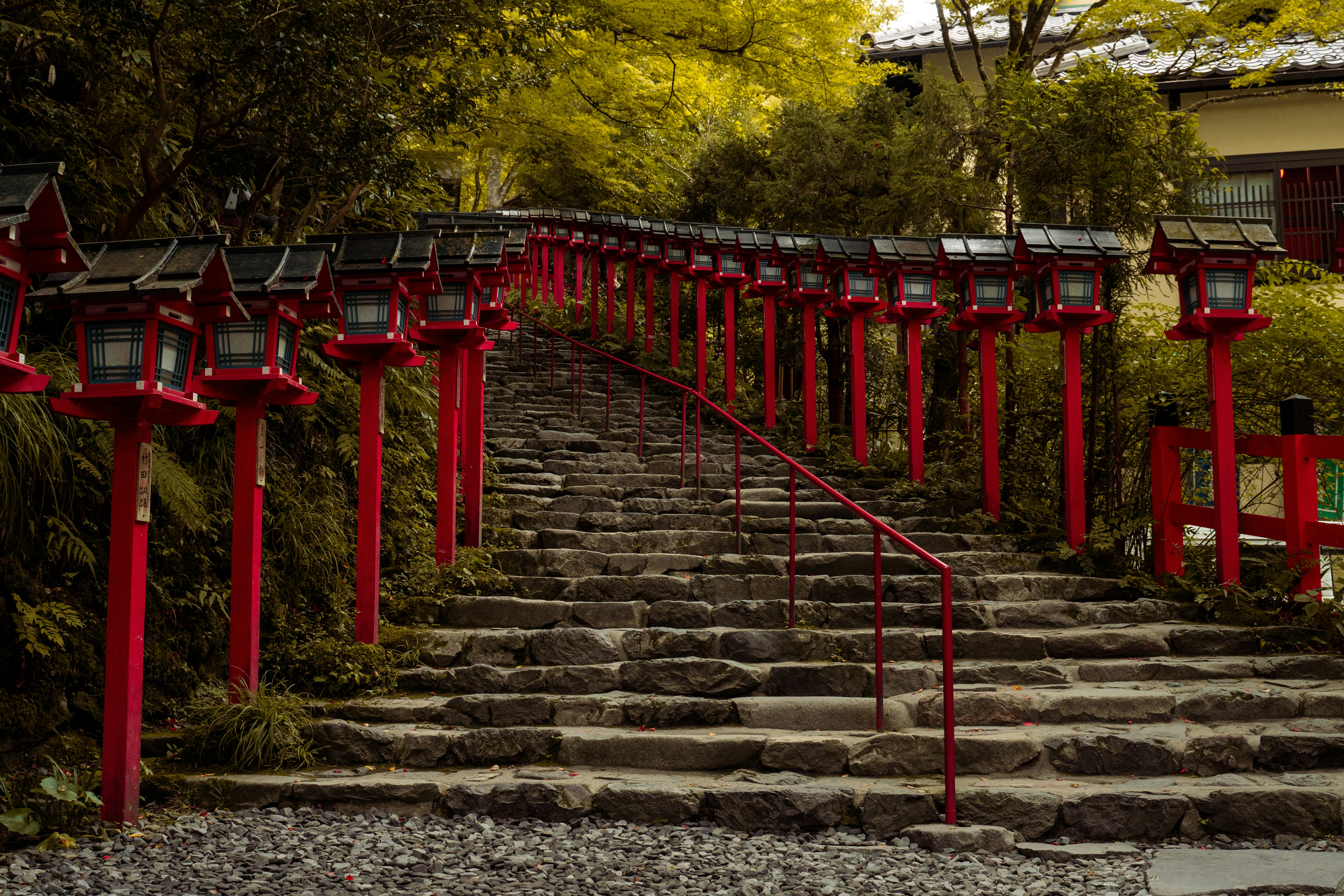 Red lanterns line the stone steps.